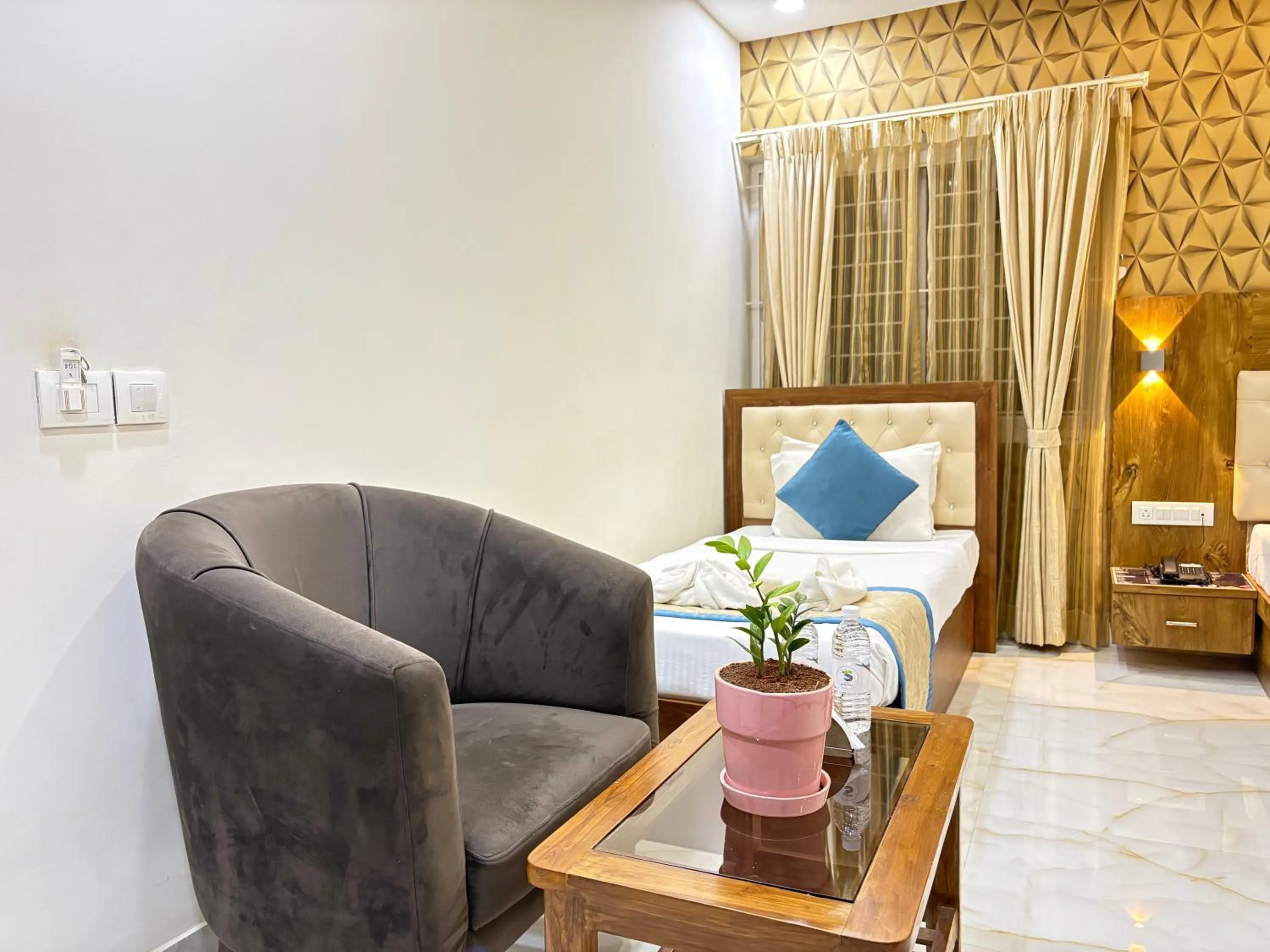 Living room, Bed in Spectra Hotel Bangalore Airport