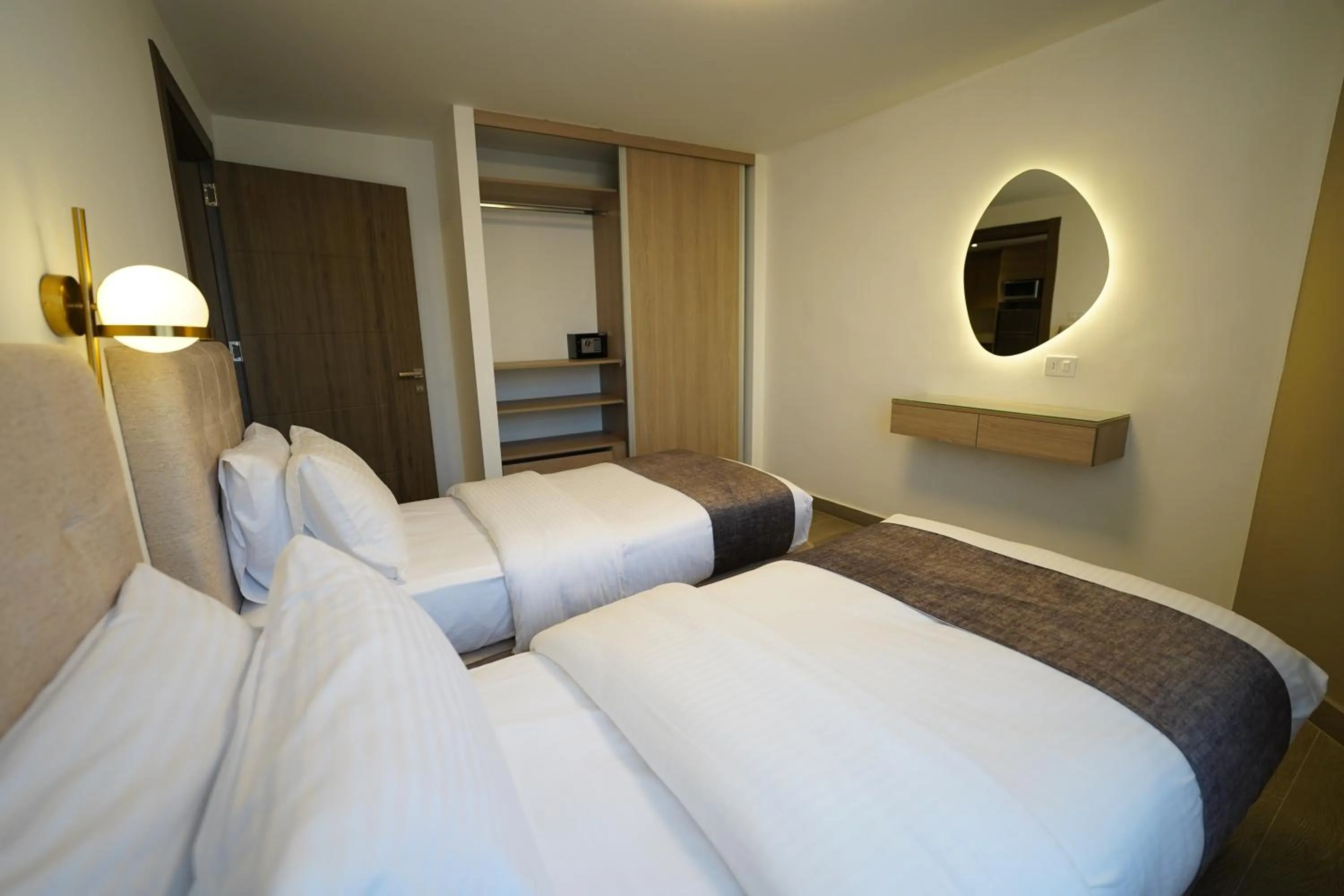 Bed in Red Carpet Hotel & Suites