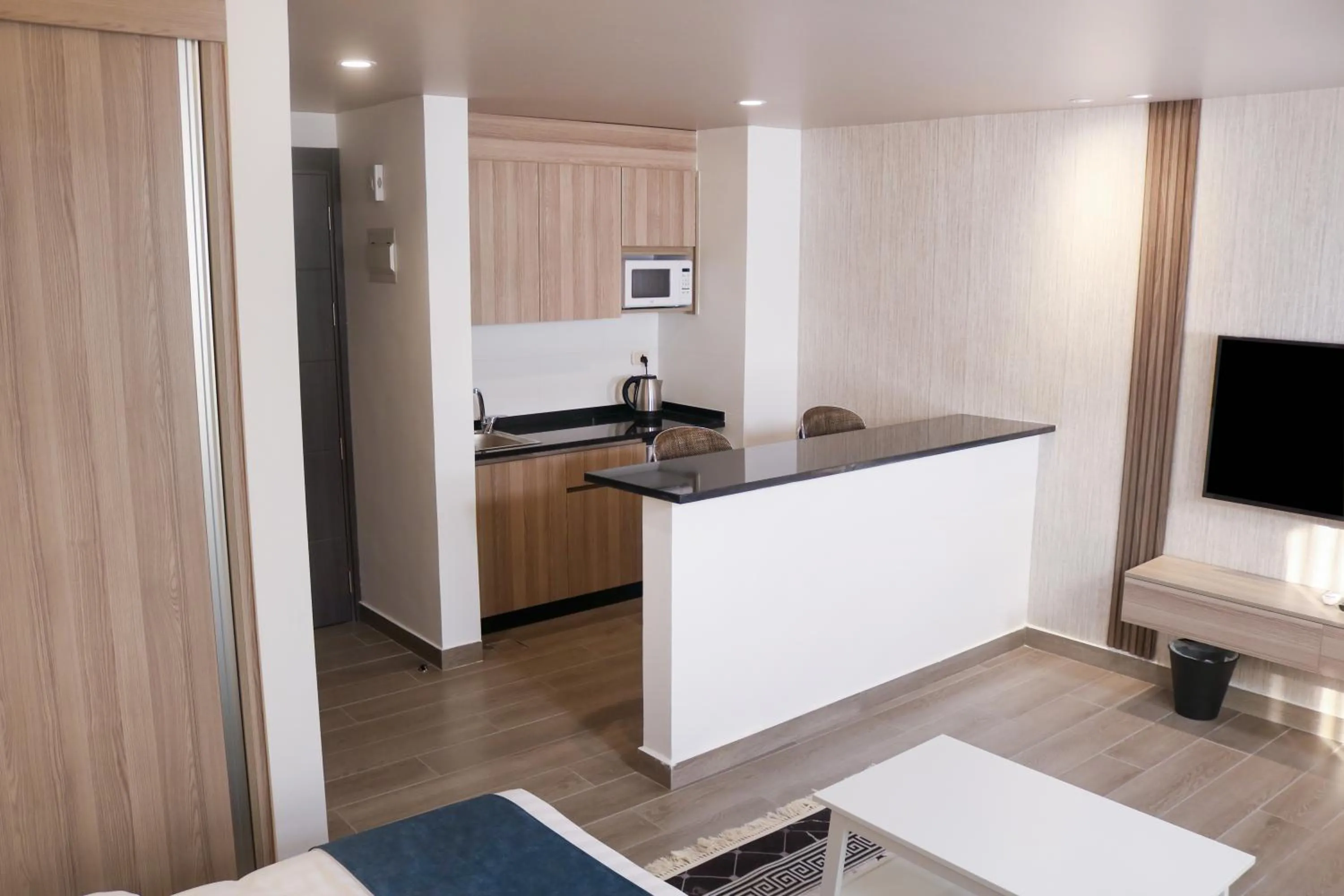Kitchen or kitchenette in Red Carpet Hotel & Suites