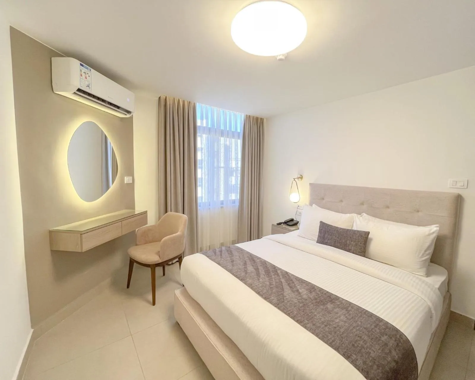 Bed in Red Carpet Hotel & Suites