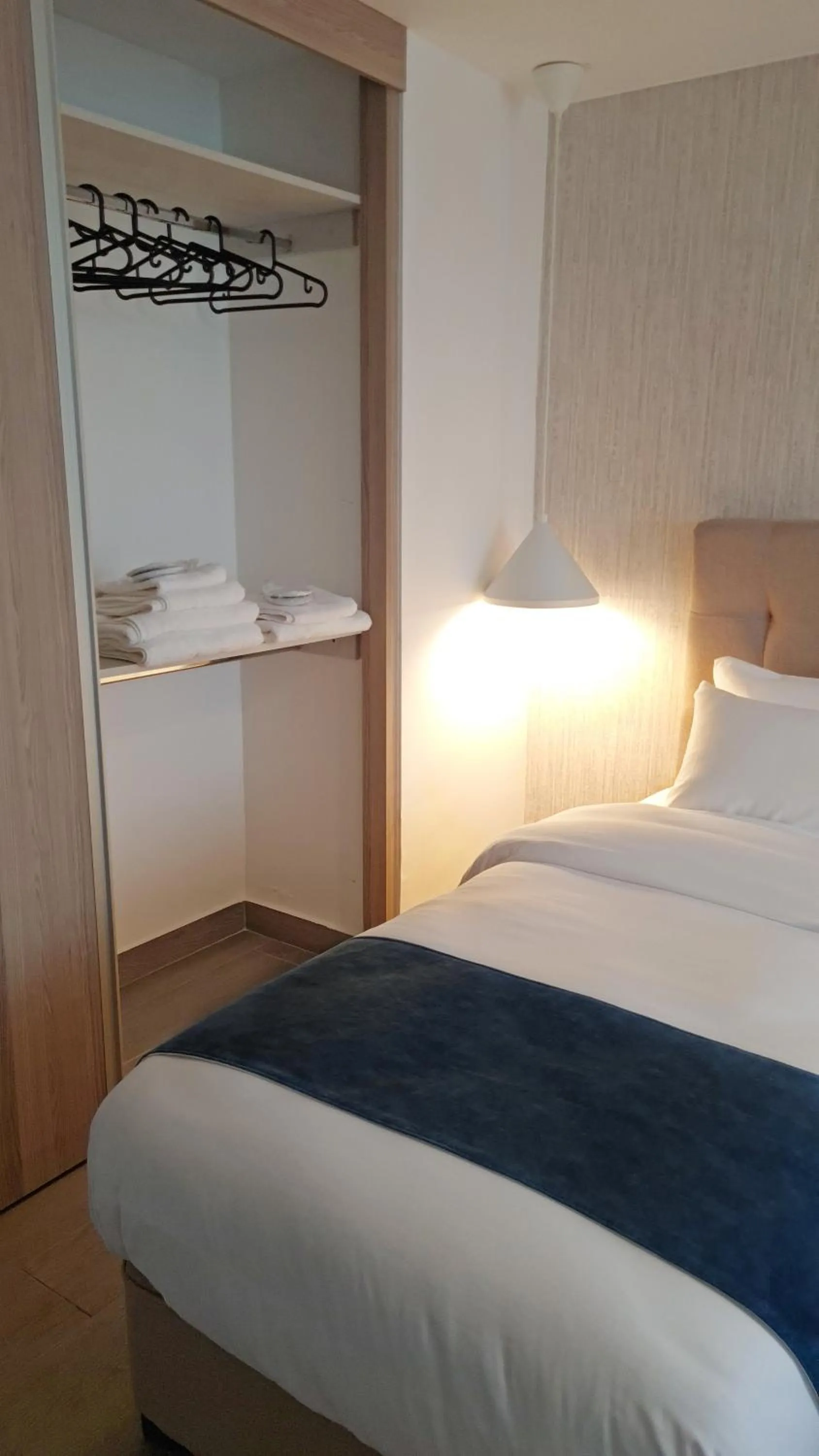 Bed in Red Carpet Hotel & Suites