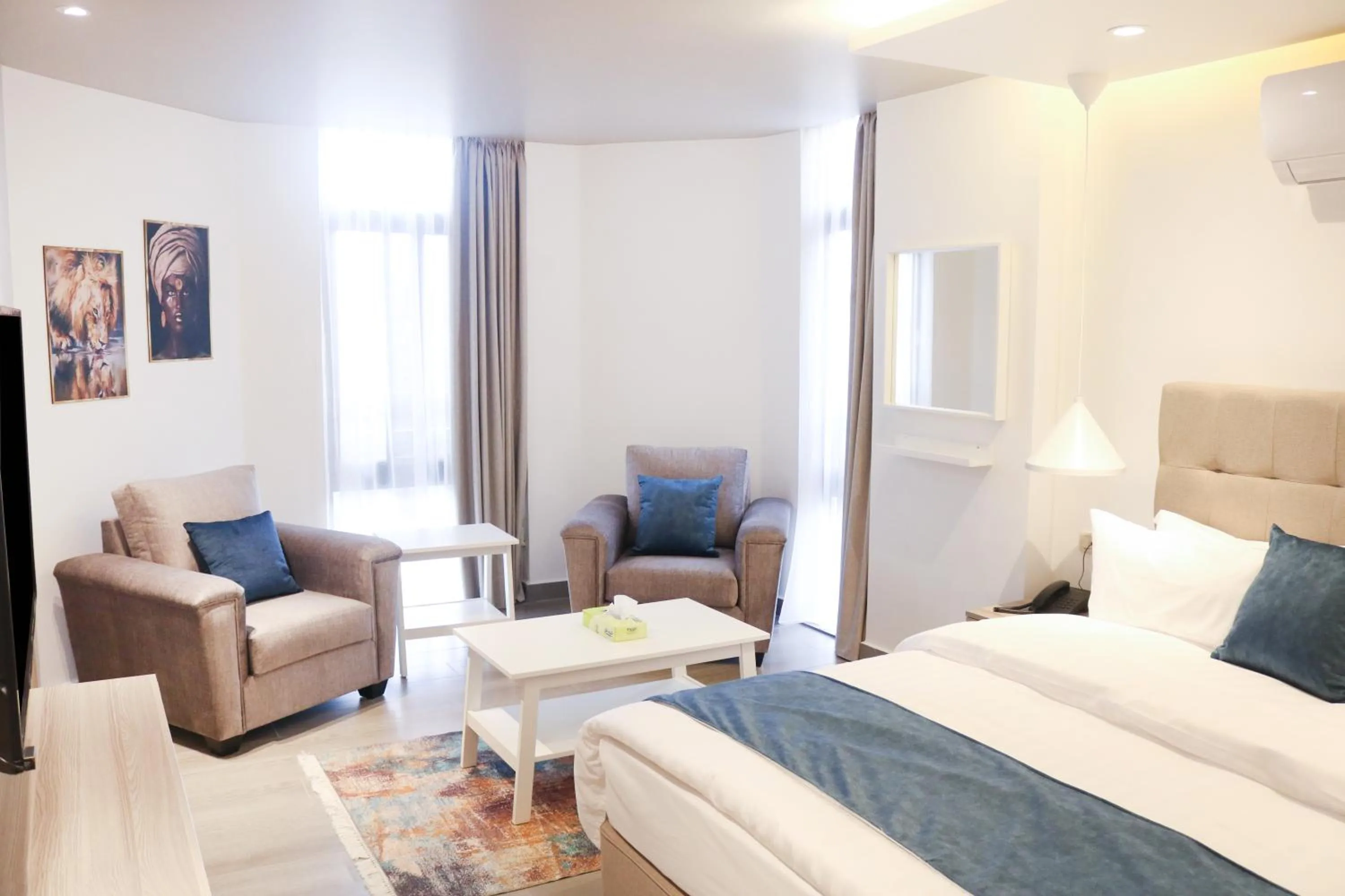 Bed in Red Carpet Hotel & Suites