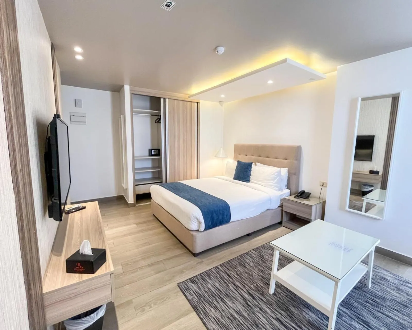 Bed in Red Carpet Hotel & Suites