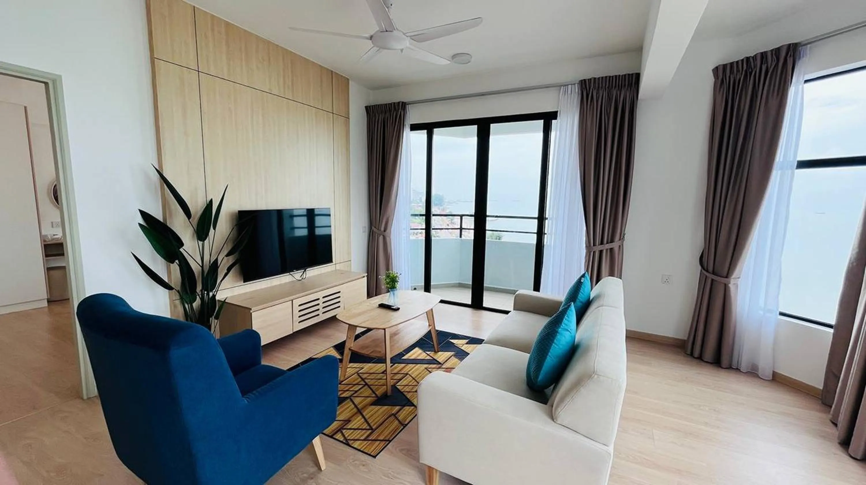 Living room in Mutiara Melaka Beach Paradise by Glex