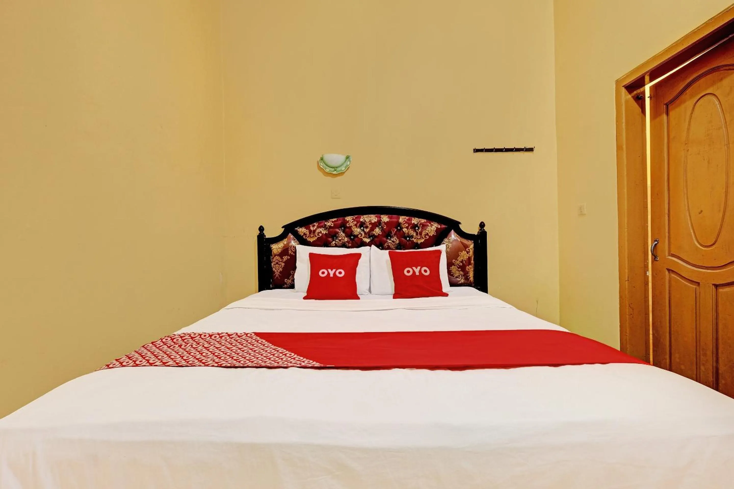 Bedroom in OYO 92406 Hotel Renata 1