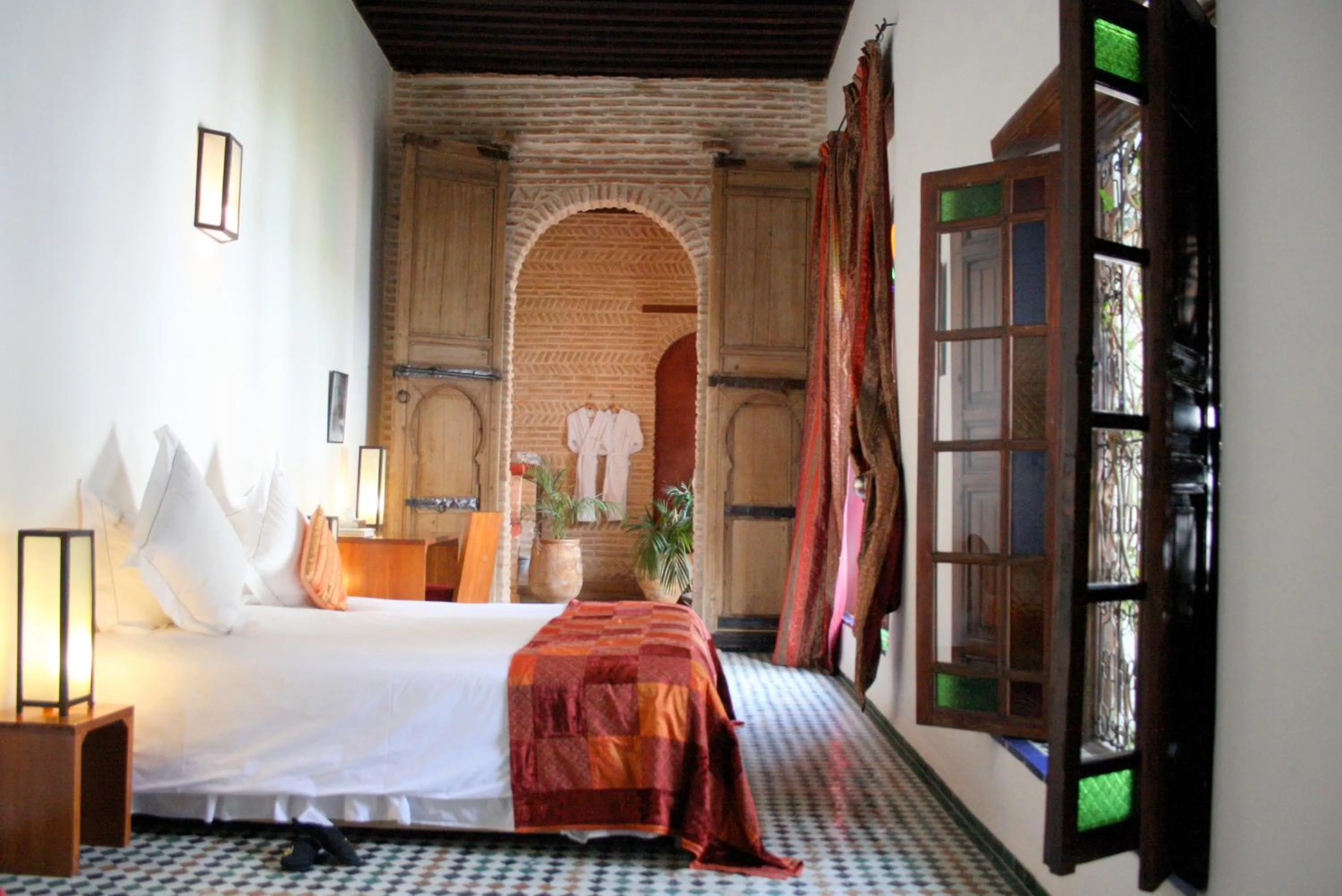 Photo of the whole room, Bed in Riad Laaroussa