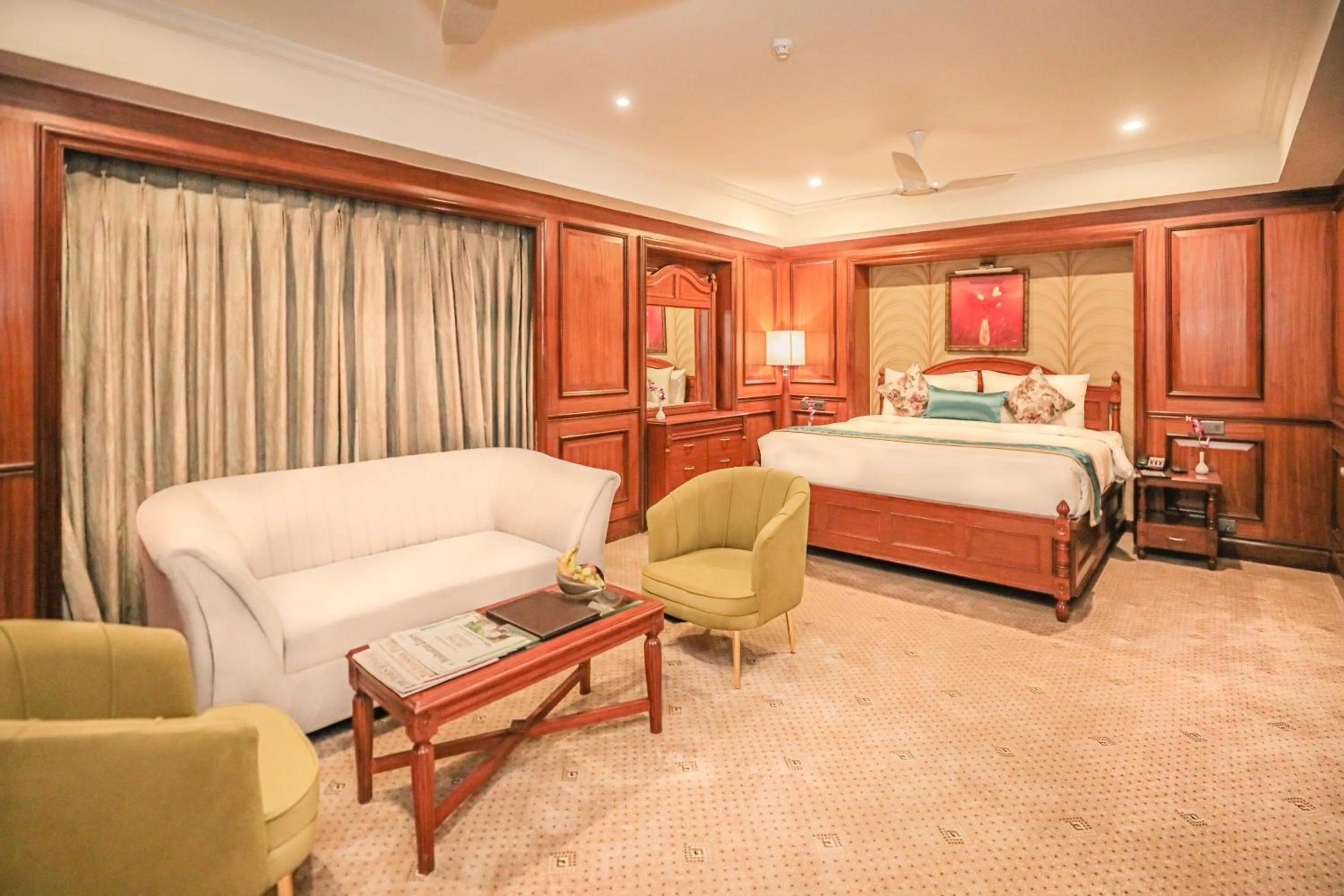 Living room, Bed in Regenta Central Lucknow by Royal Orchid Hotels Limited