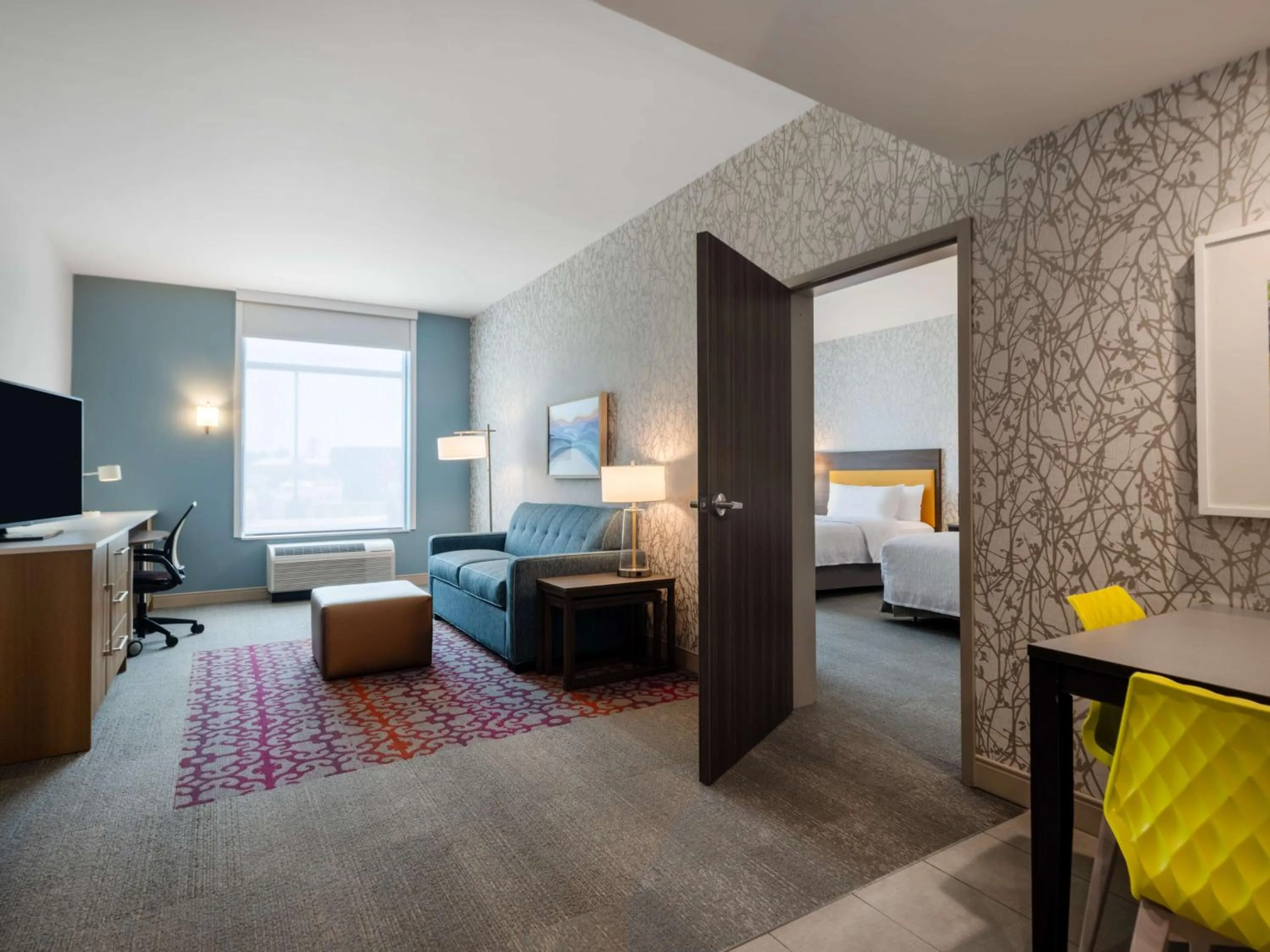 Living room, Bed in Home2 Suites By Hilton Santa Rosa Beach