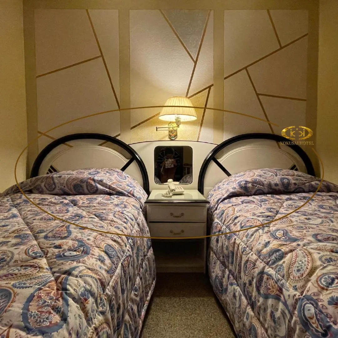 Bed in Hotel Kokusai
