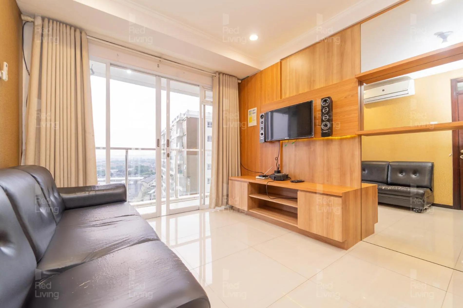 Living room in RedLiving Apartemen Gateway Pasteur - Sean Hospitality