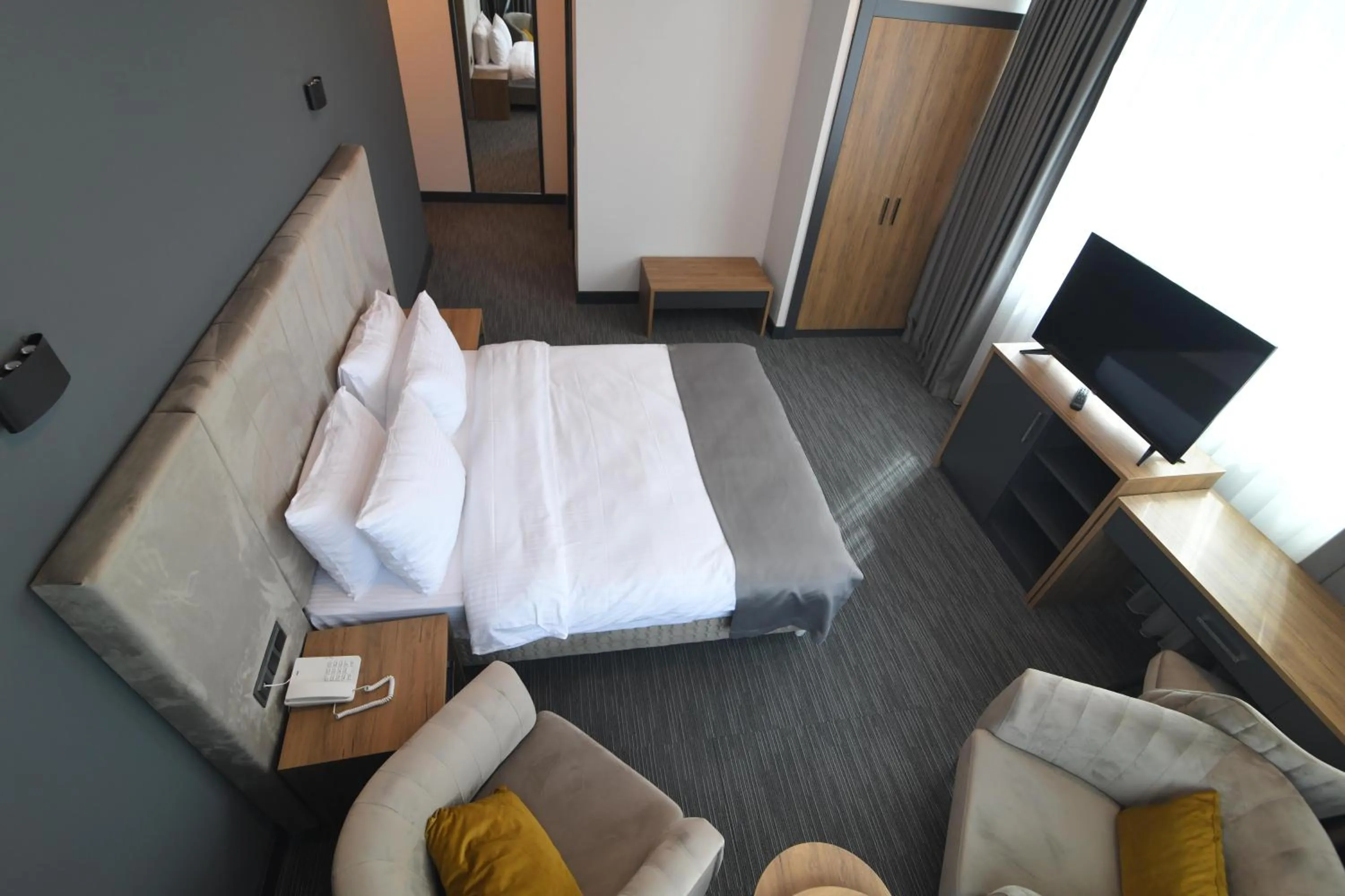 Seating area, Bed in HOME PLUS Hotel