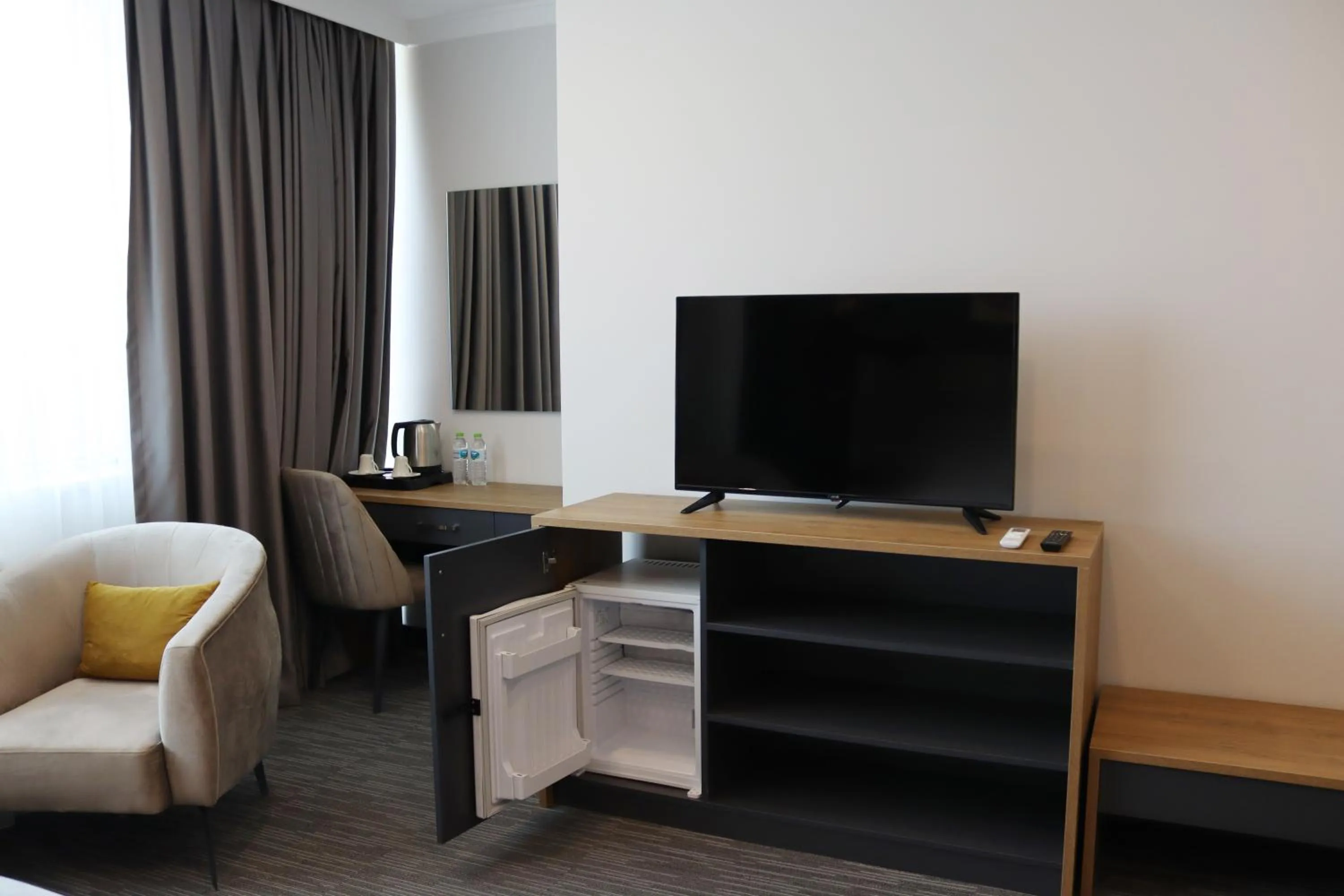 Communal lounge/ TV room in HOME PLUS Hotel