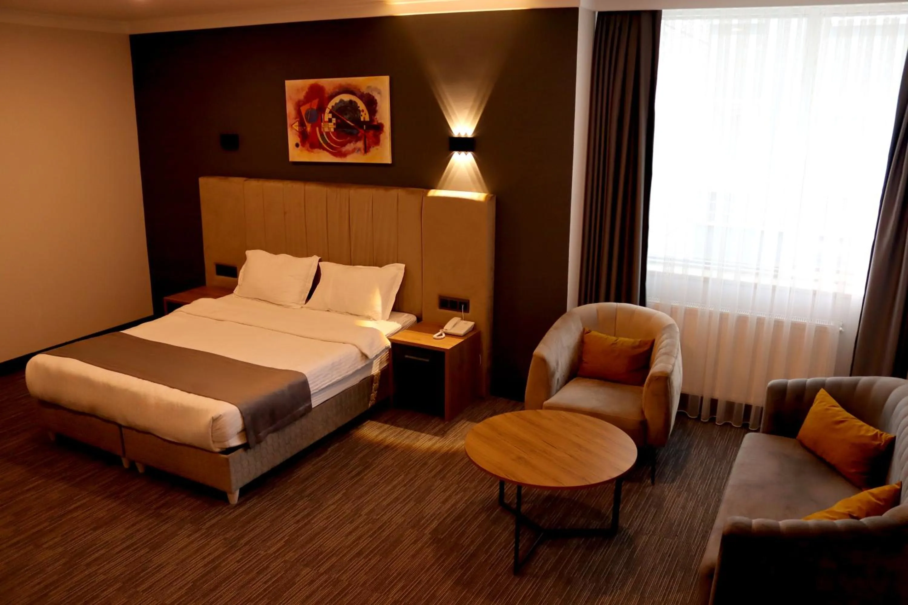 Seating area, Bed in HOME PLUS Hotel