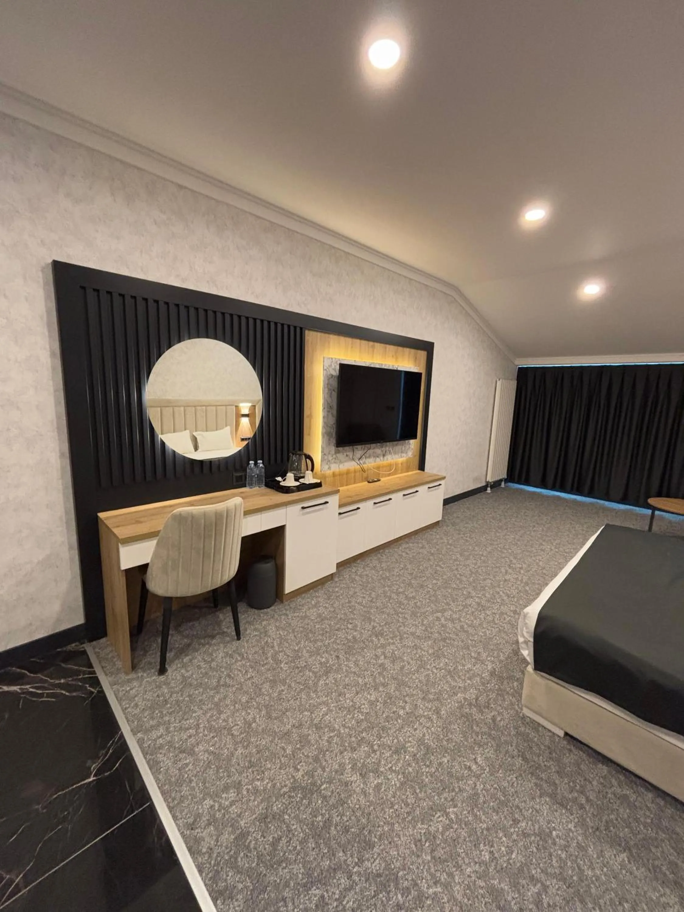 Living room, Bed in HOME PLUS Hotel