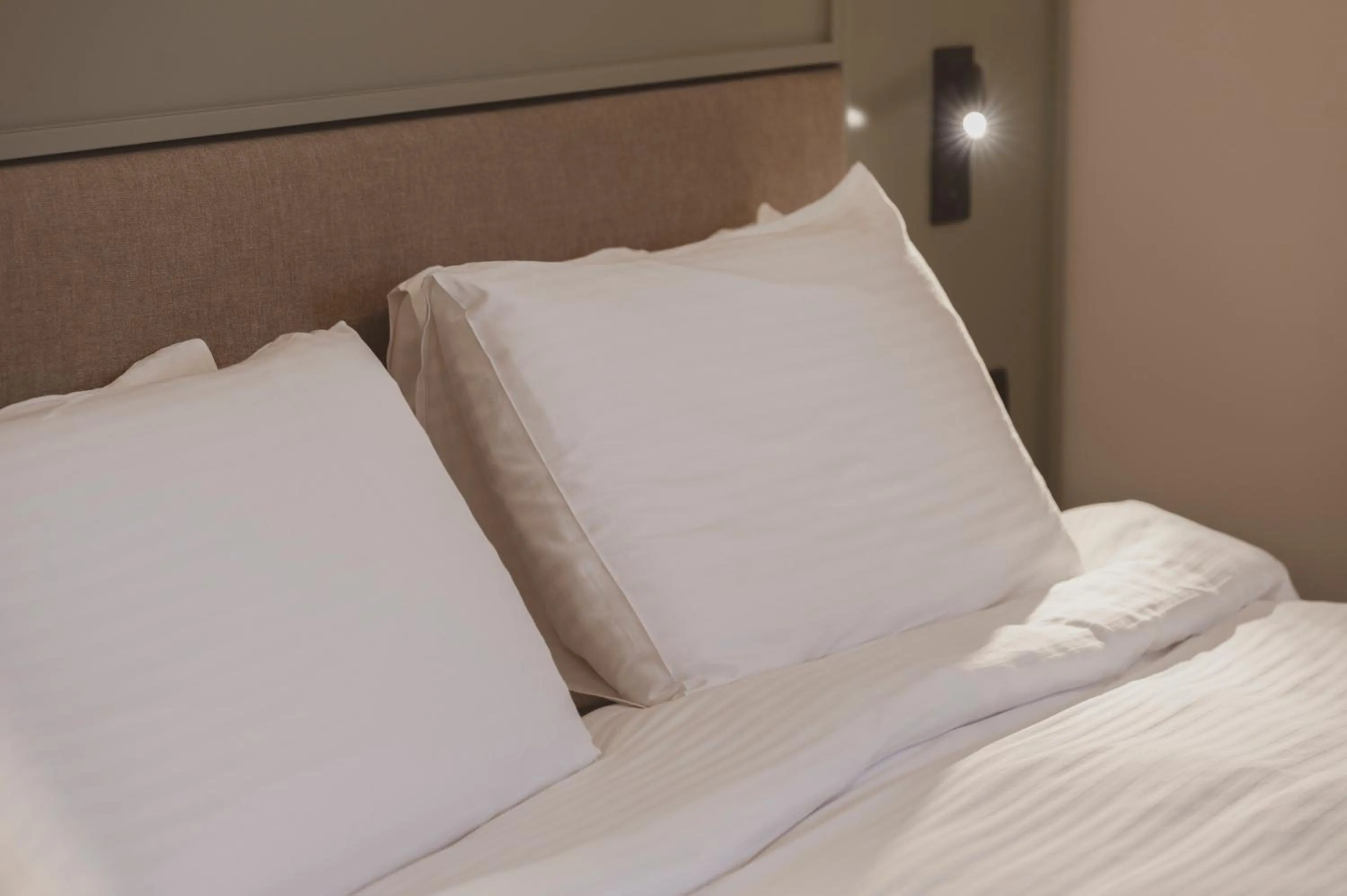 Bed in Maria Rosa Suites