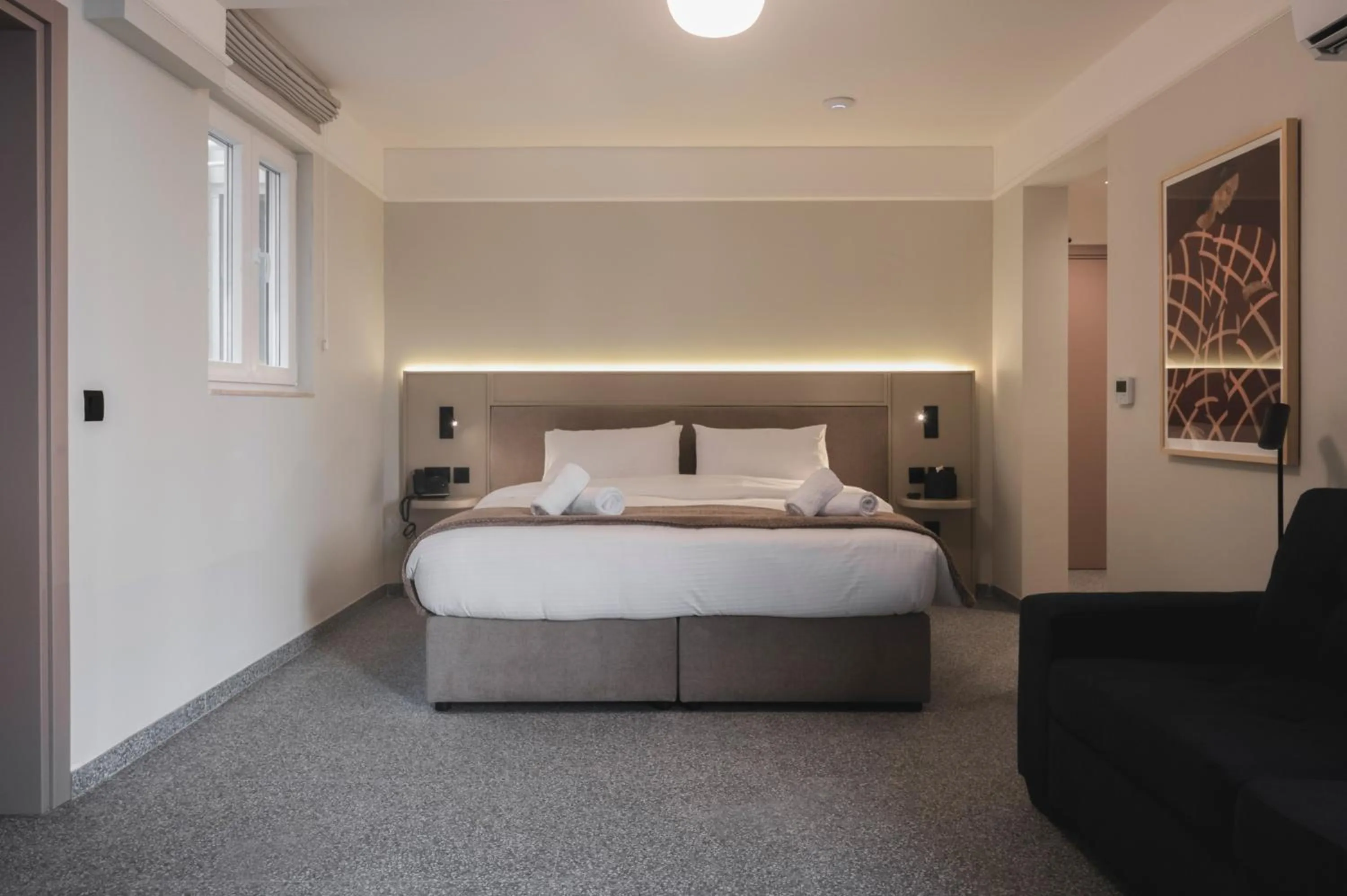 Bed in Maria Rosa Suites