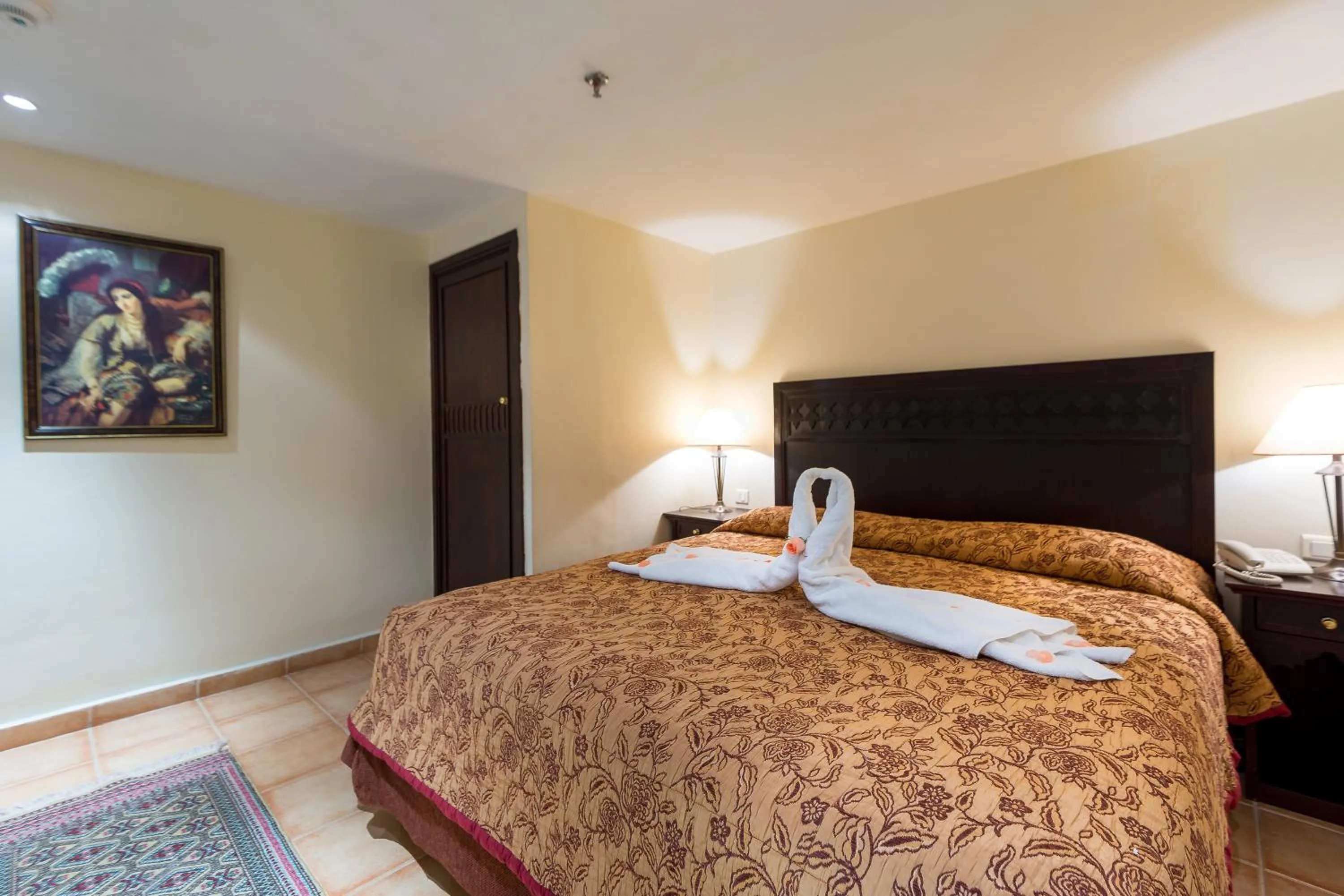 Bed in Kennedy Hospitality Resort