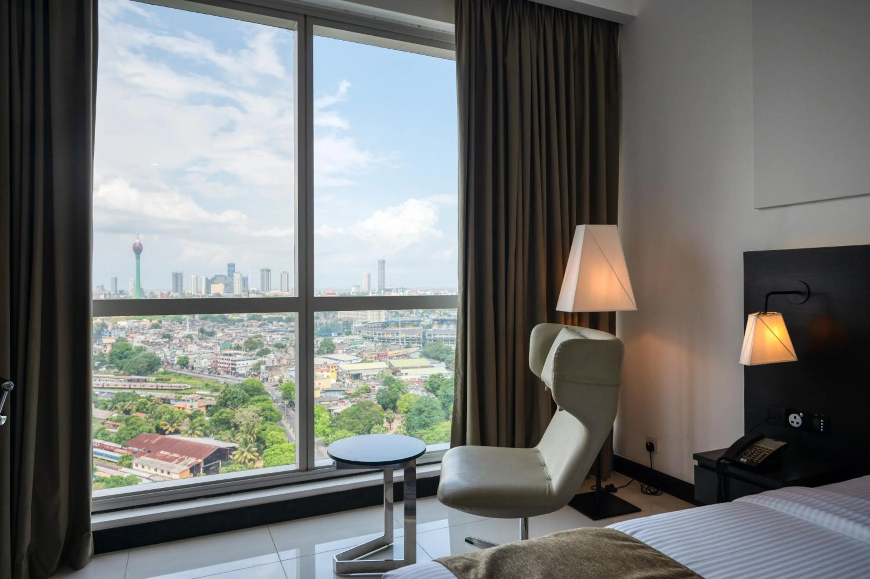 Seating area, Bed in Orion City Hotel