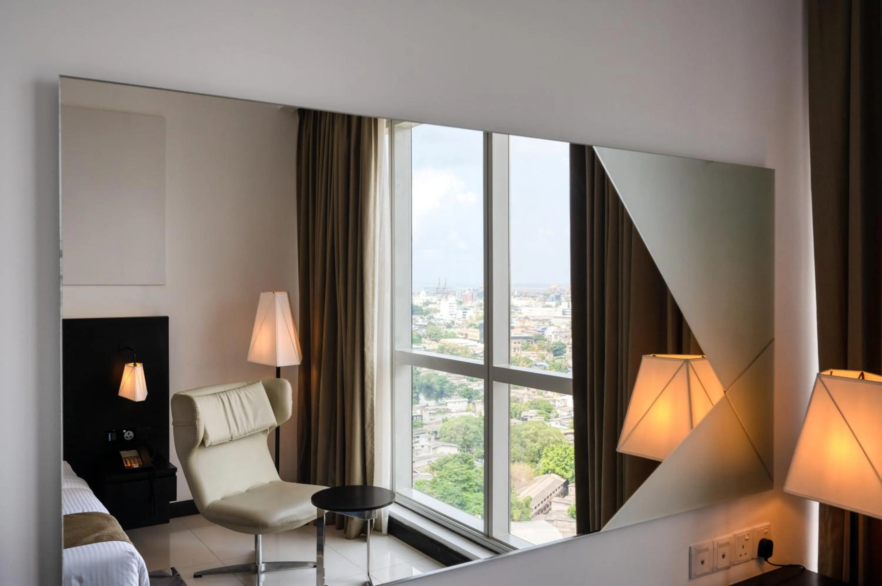 Seating area, Bed in Orion City Hotel