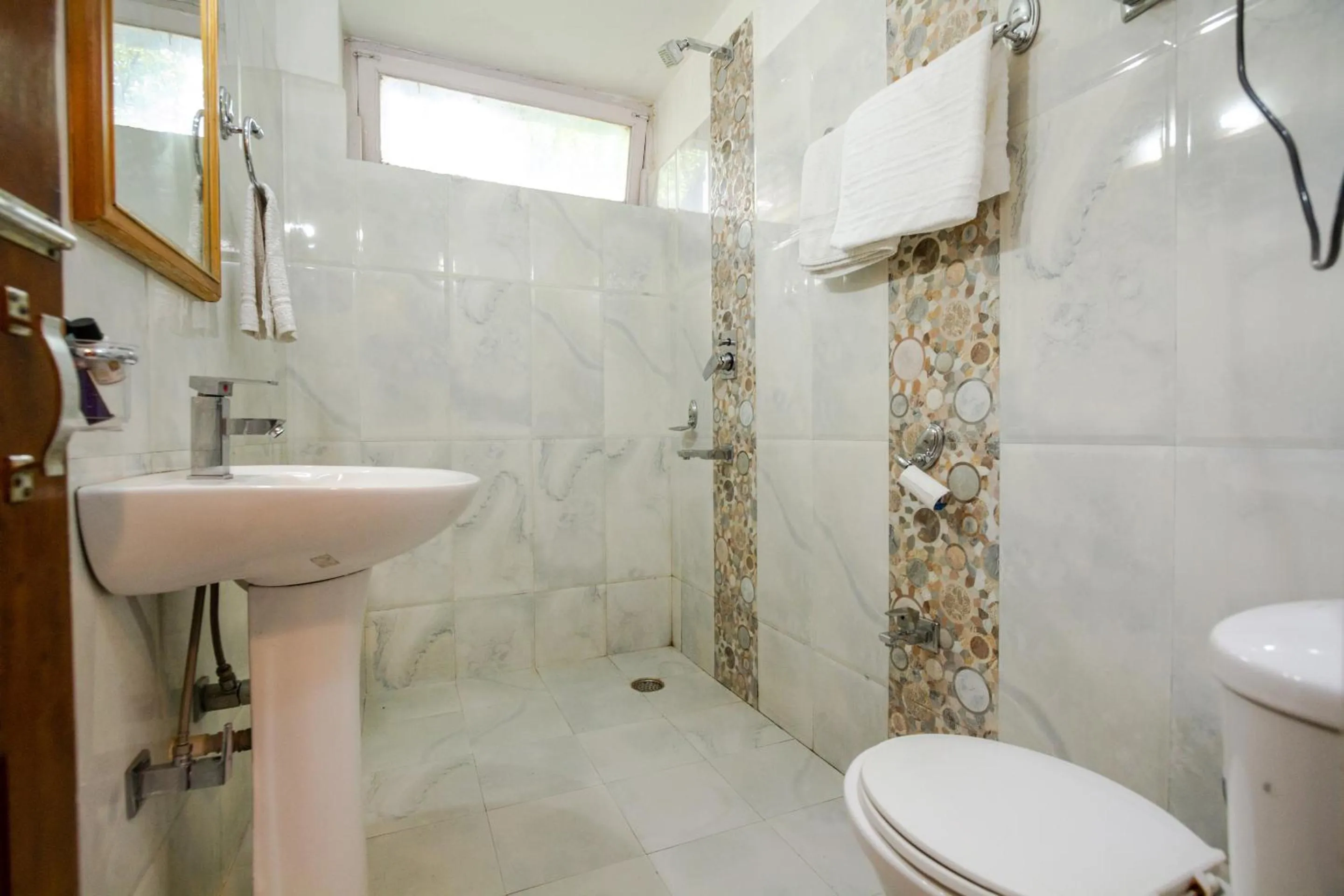 Bathroom in Holiday Home International -Vivaan Stays