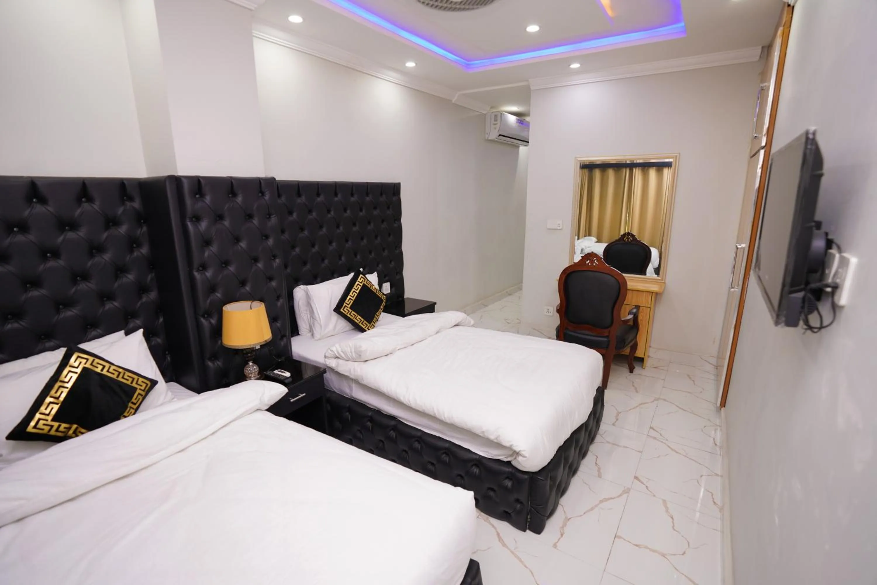 Bed in Hotel Orange One