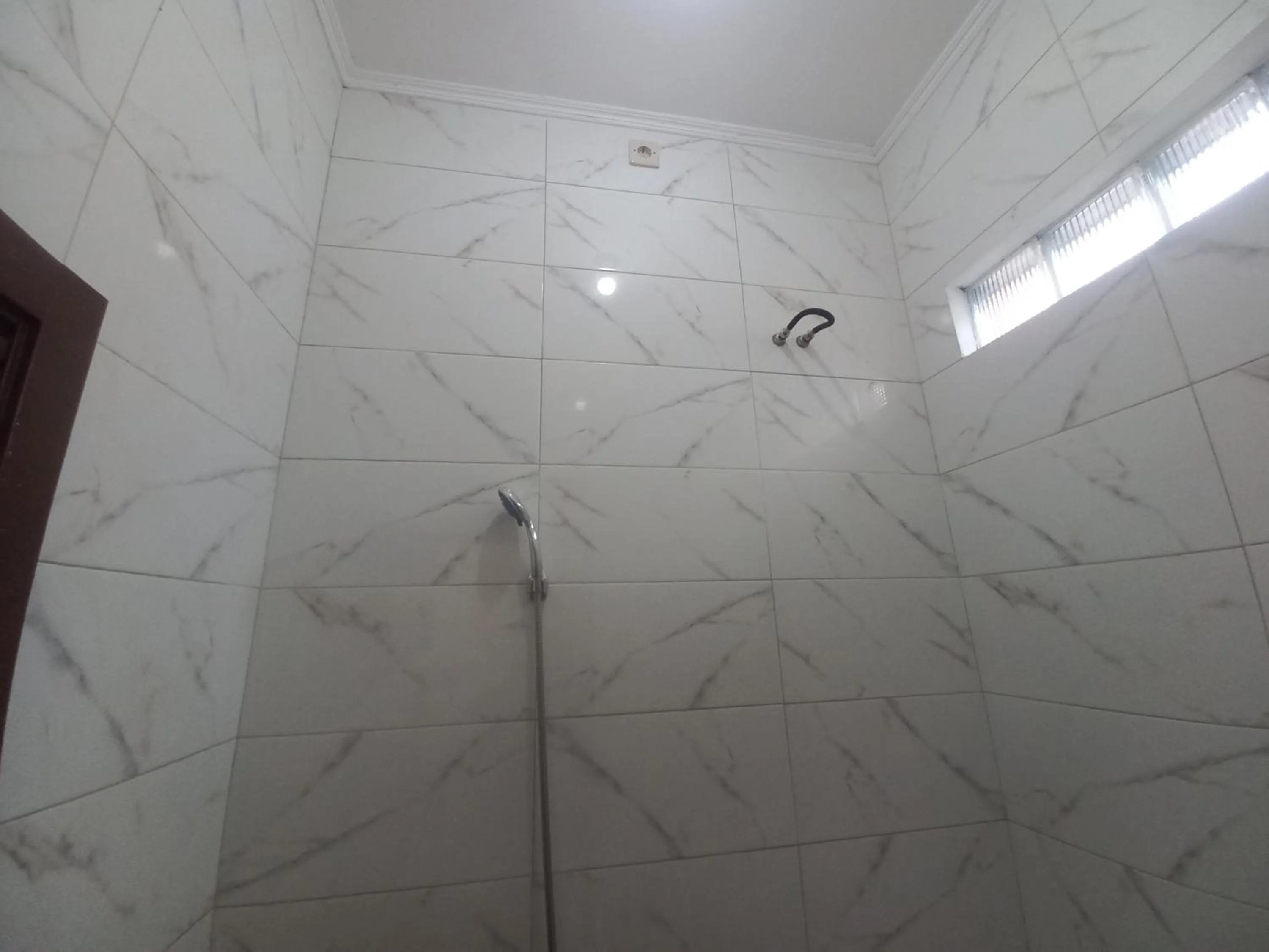 Bathroom in SPOT ON 92415 Bima House Syariah