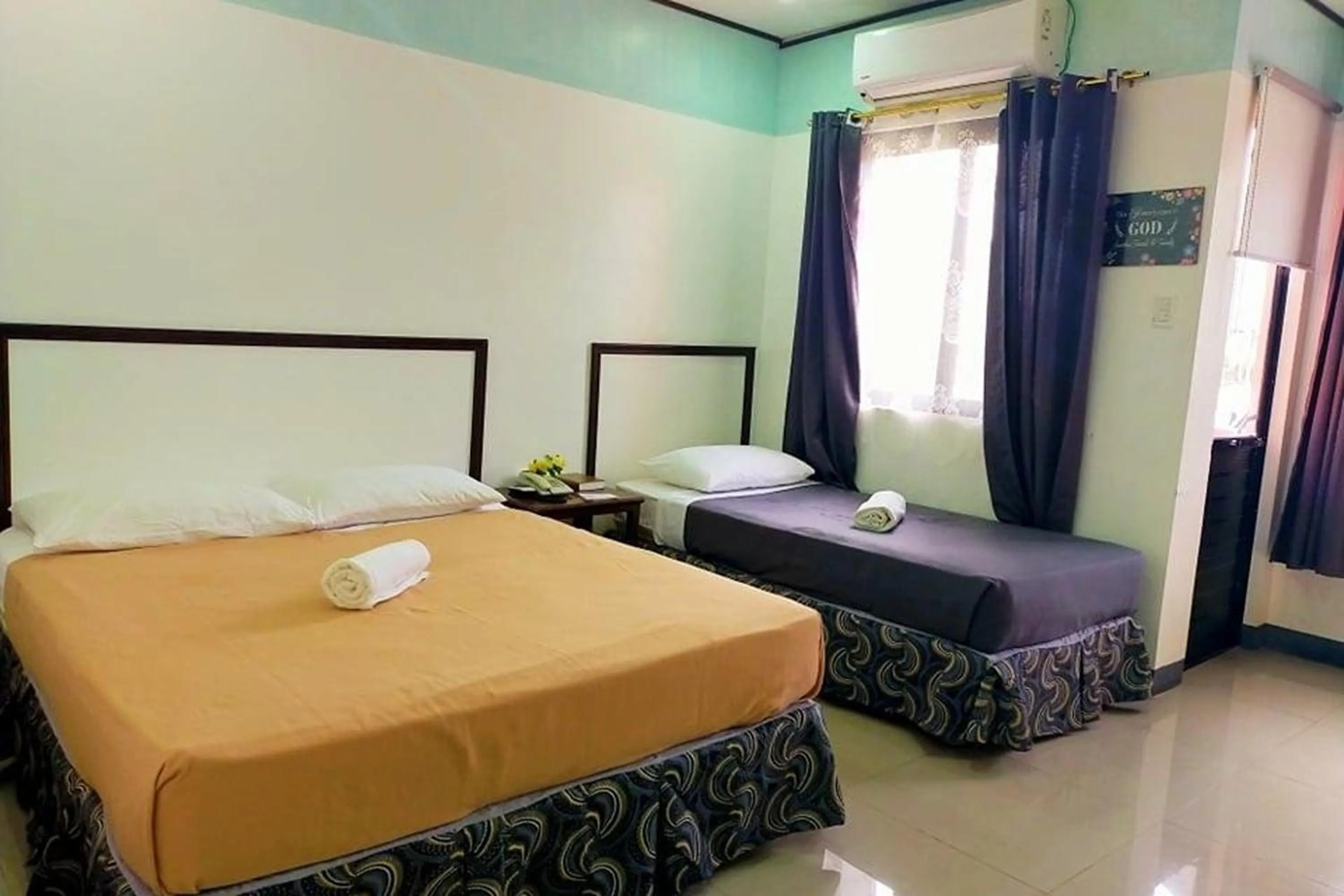 Bed in EC Hotel near Laoag Airport