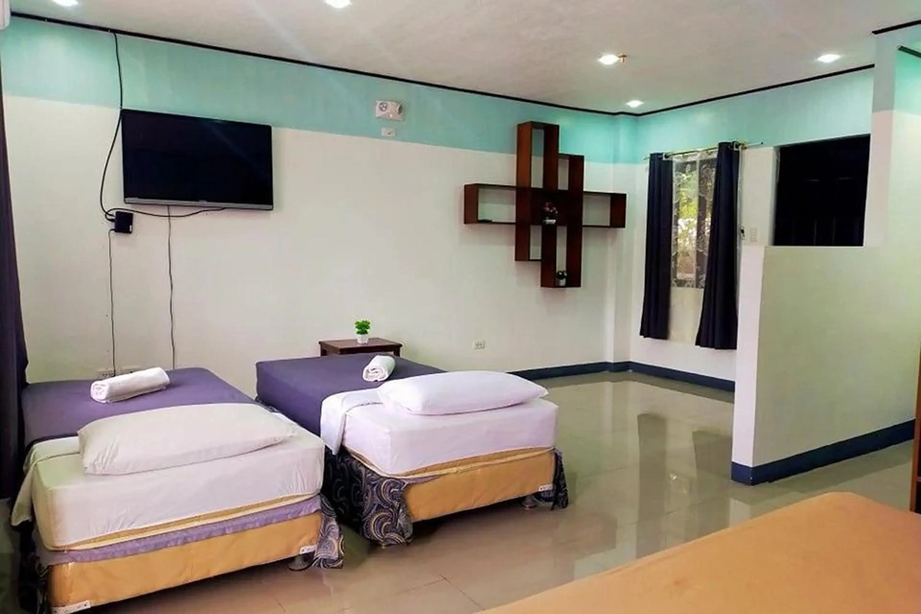 Bed in EC Hotel near Laoag Airport