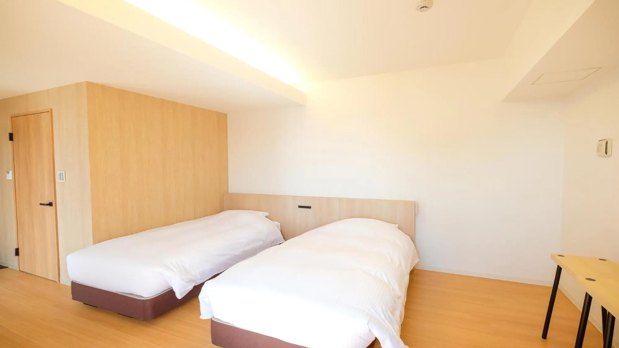 Bed in ELE Hotel Kuzuha