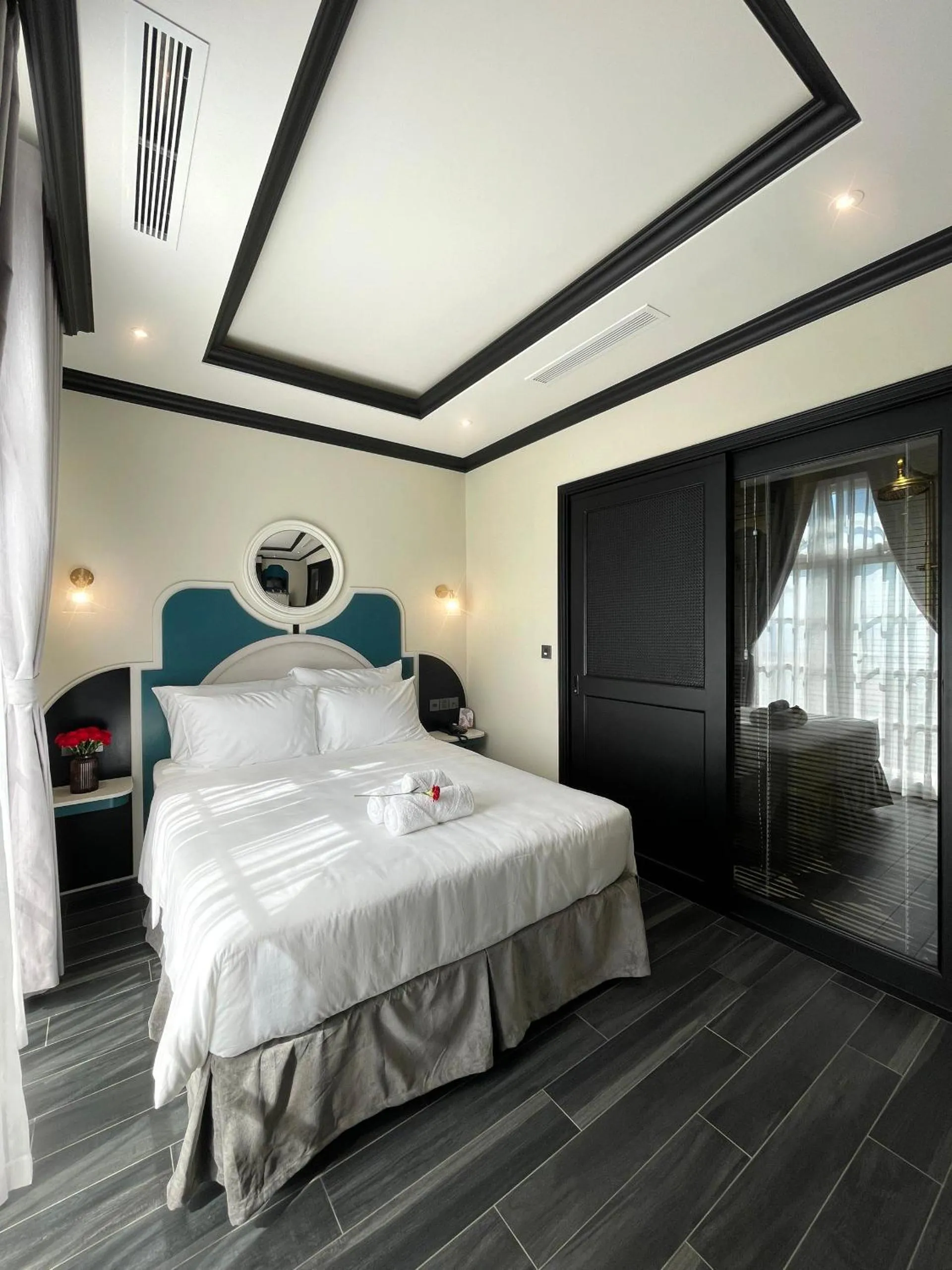 Bed in Le Bonheur Hotel