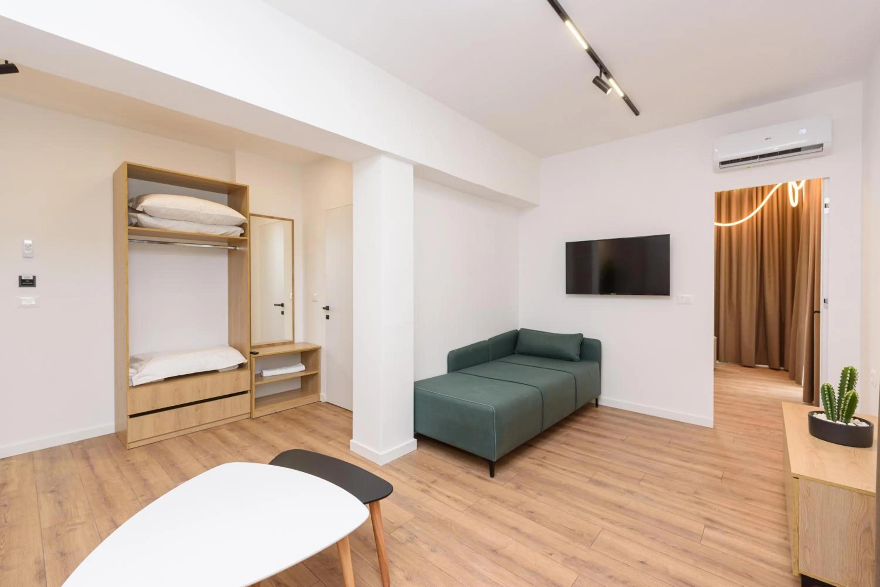 Communal lounge/ TV room, Bed in Sea & Sand Hotel