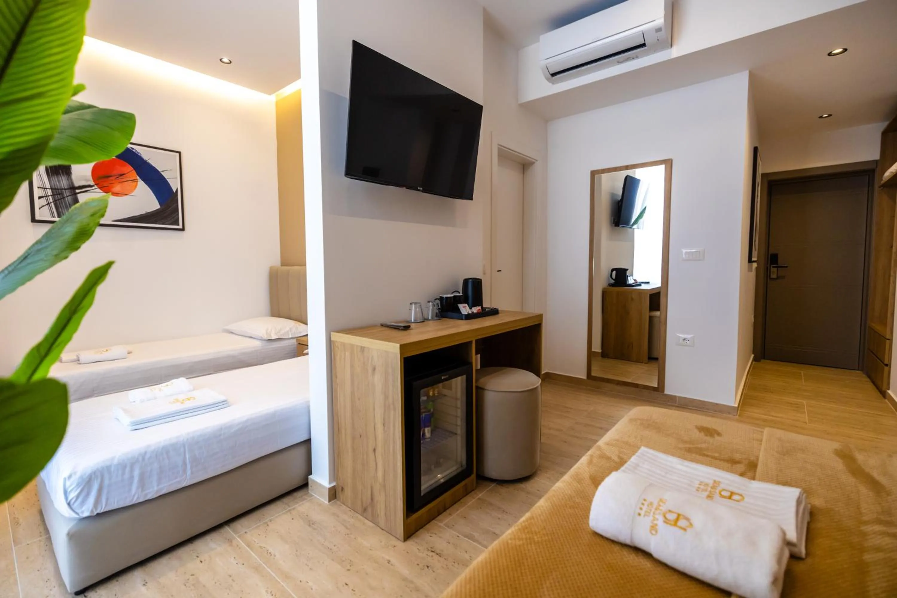 Communal lounge/ TV room, Bed in Sea & Sand Hotel