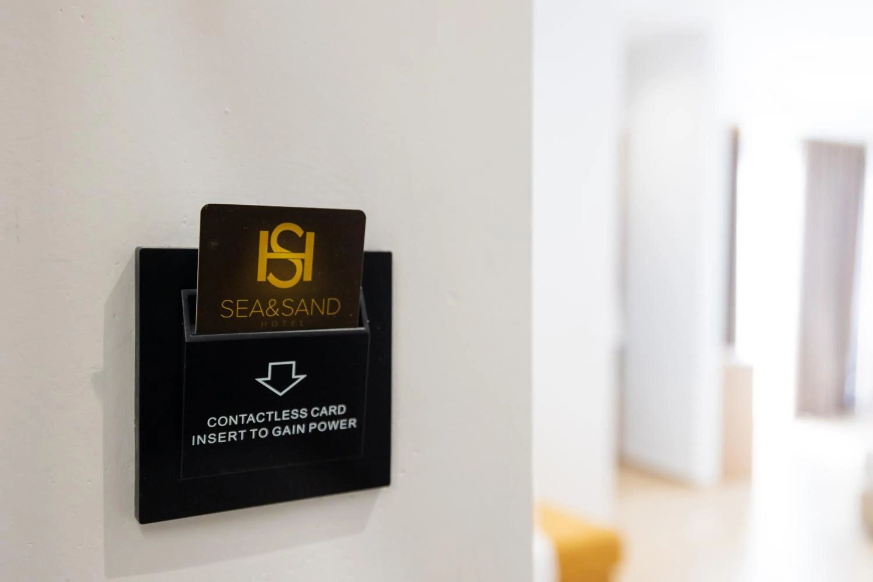 Property logo or sign in Sea & Sand Hotel