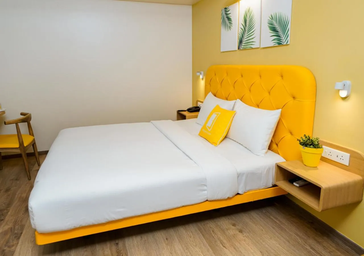 Photo of the whole room, Bed in Bloom Hotel - Koregaon Park