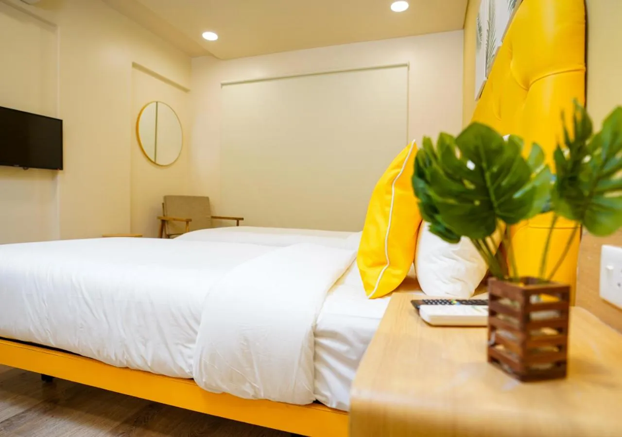 Photo of the whole room, Bed in Bloom Hotel - Koregaon Park