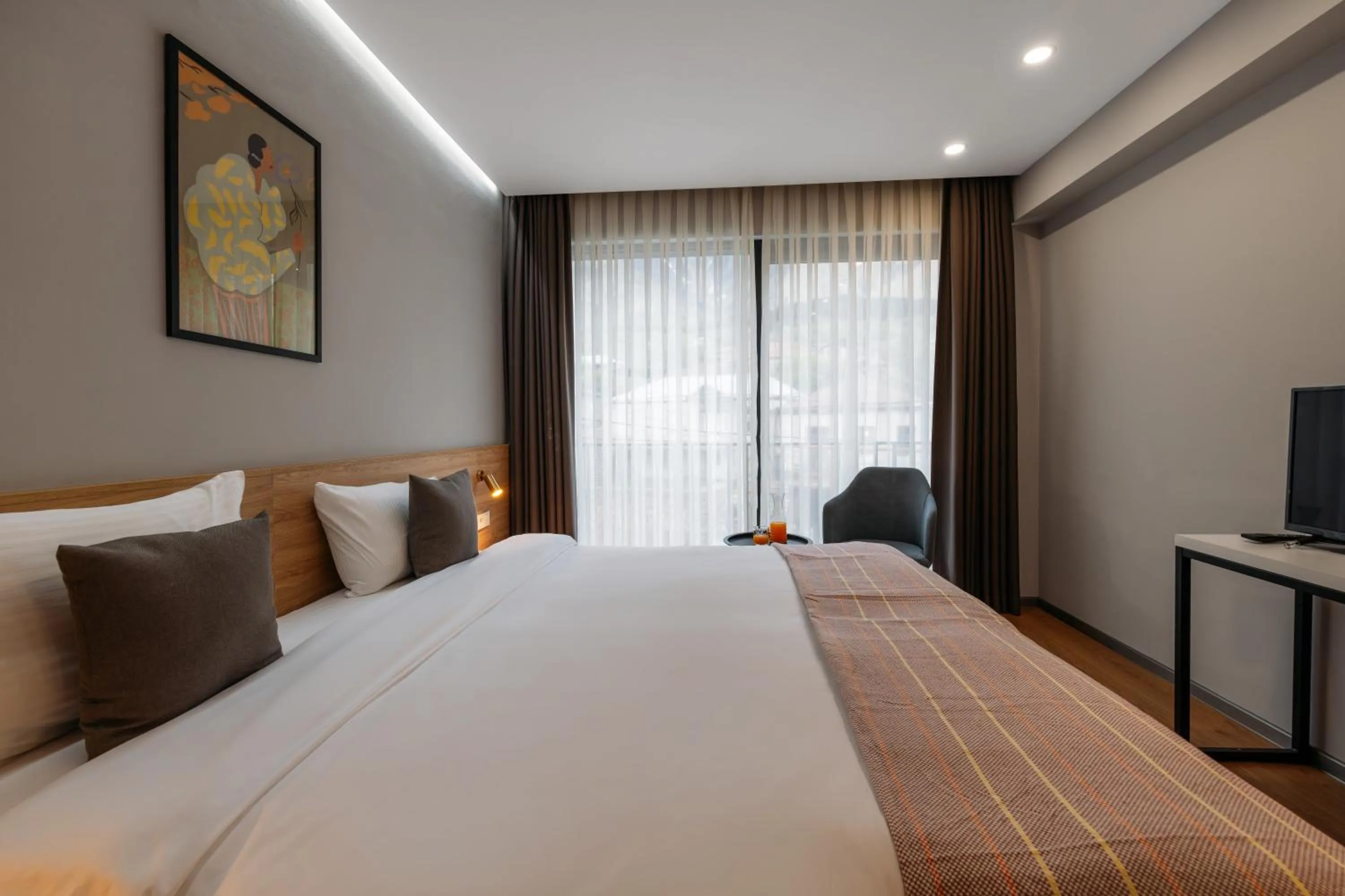 Bed in Hotel Memoir Kazbegi by DNT Group