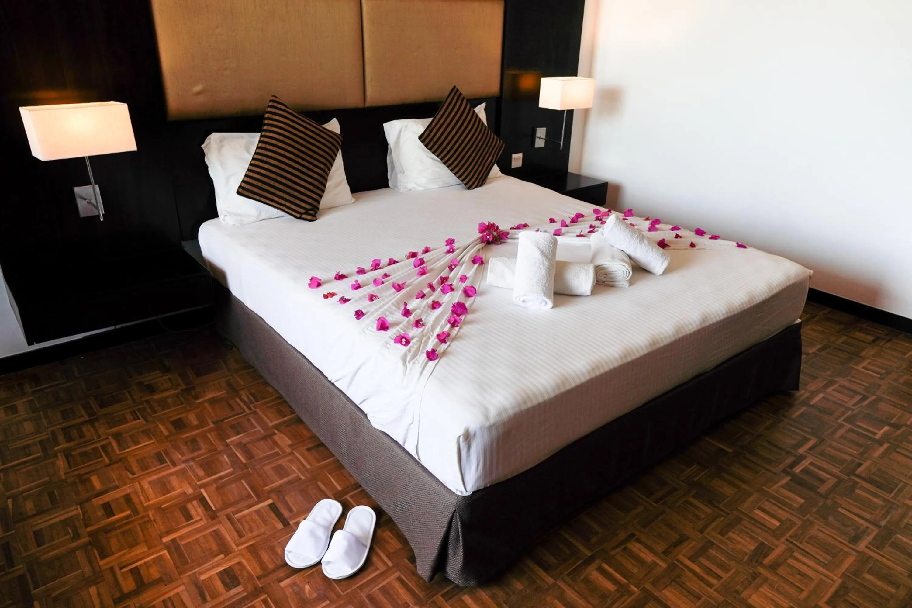 Bed in Peacock Beach Resort and Spa