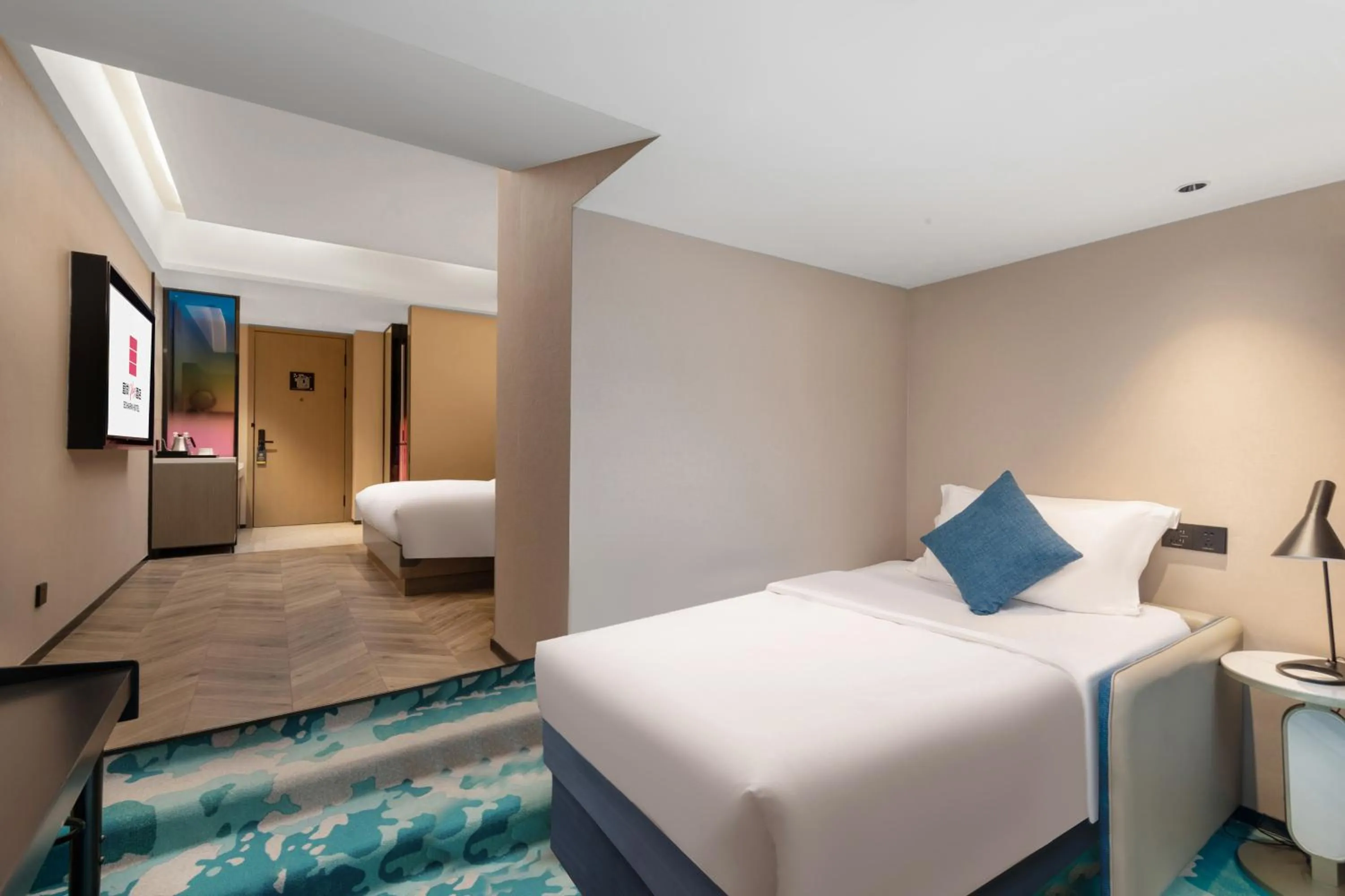 Bed in Echarm PLUS International Hotel Zhujiang New Town Wuyangcun Metro Station