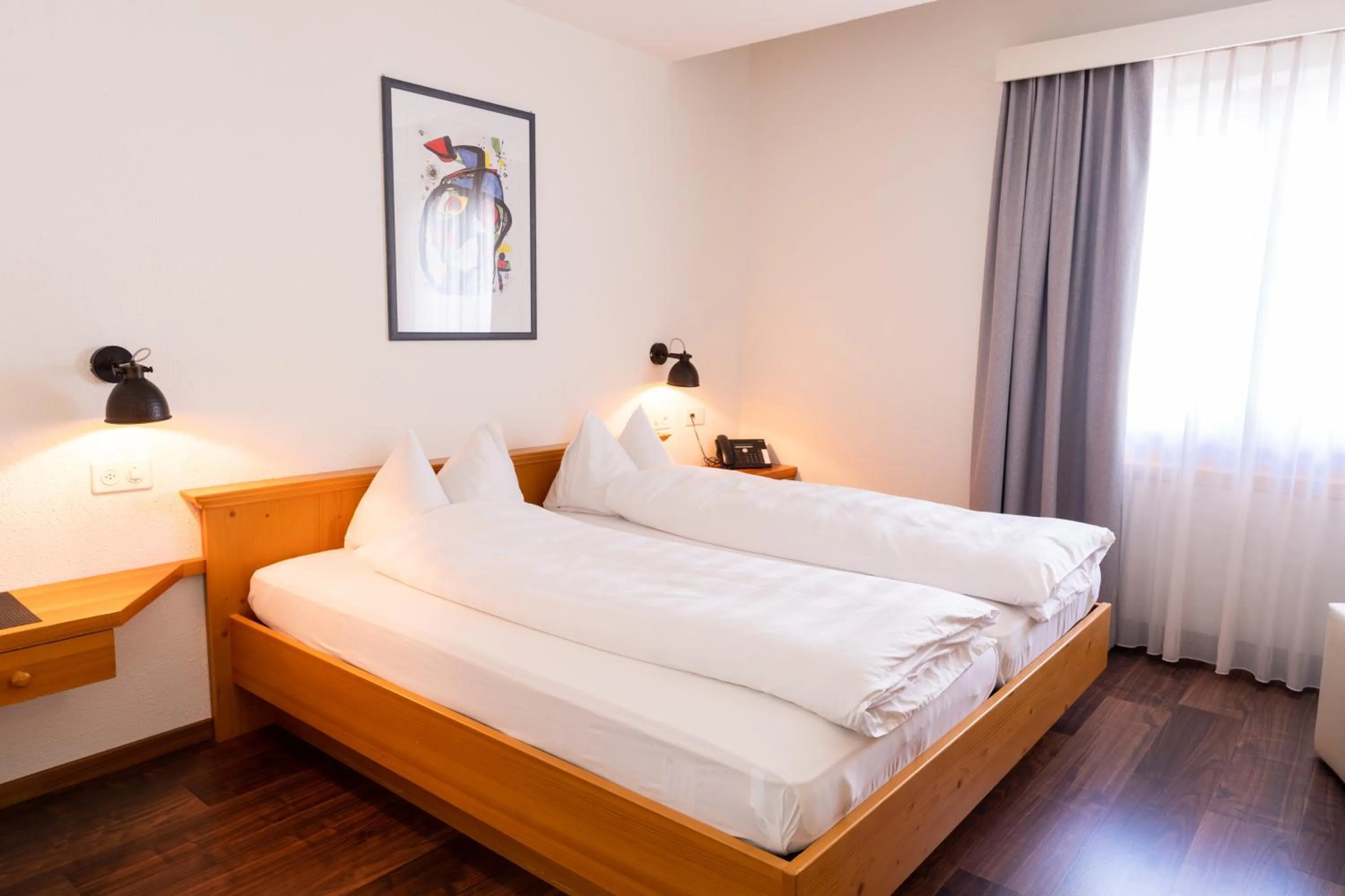 Bed in Hotel Schatzmann