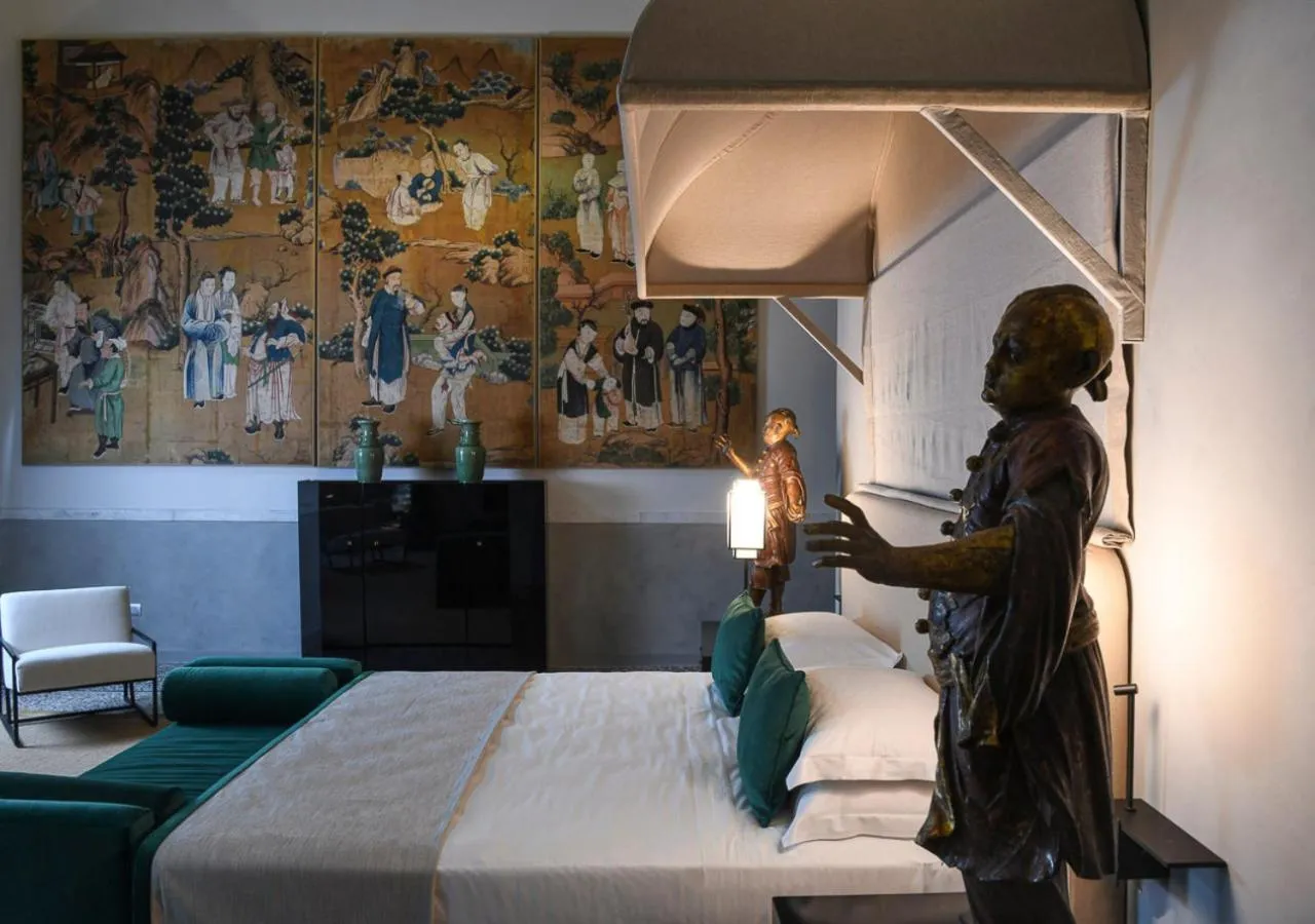 Bed in Hotel Palazzo Durazzo Suites