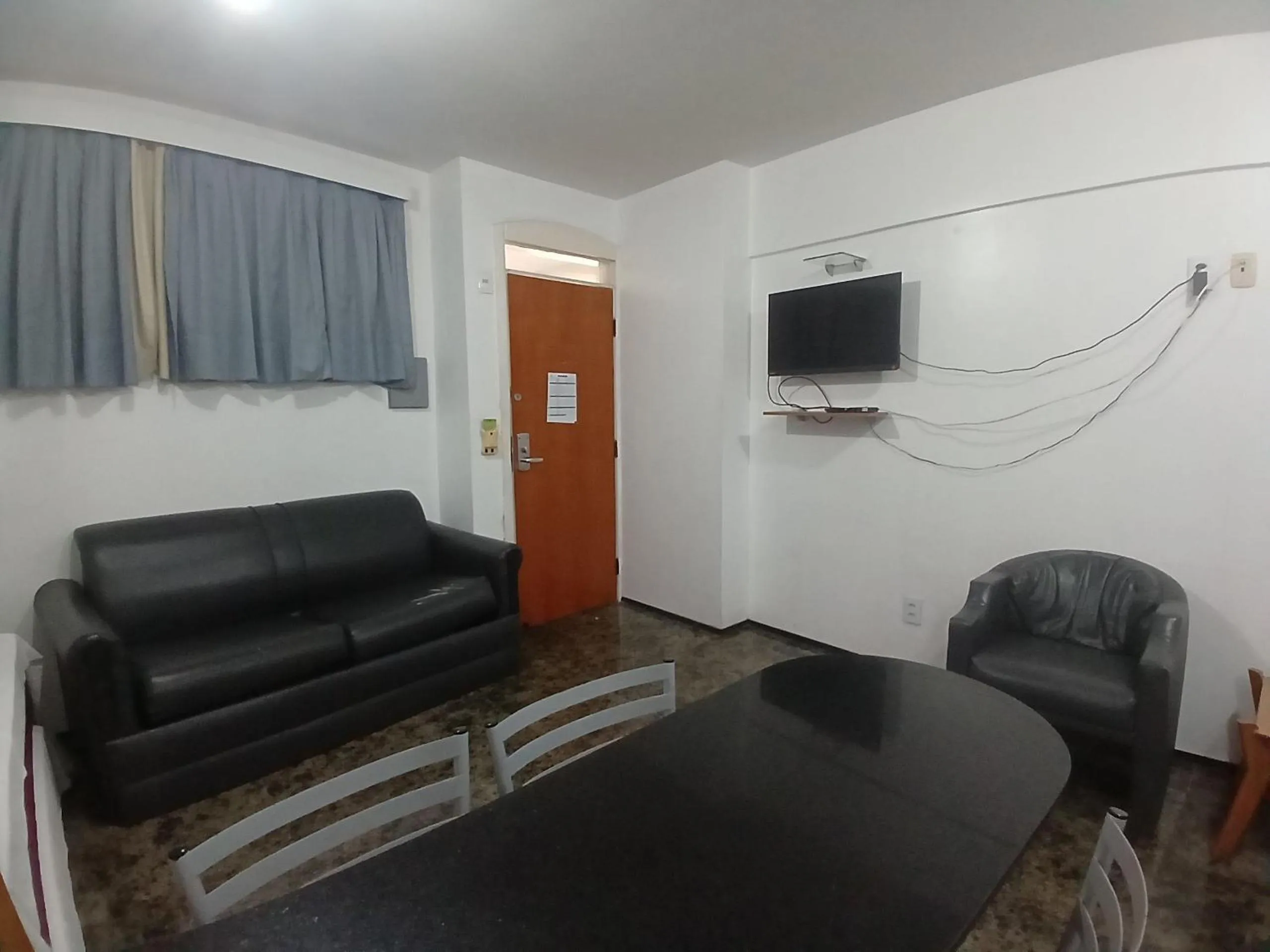 Living room in Flat Brasil Tropical Meireles by Escala