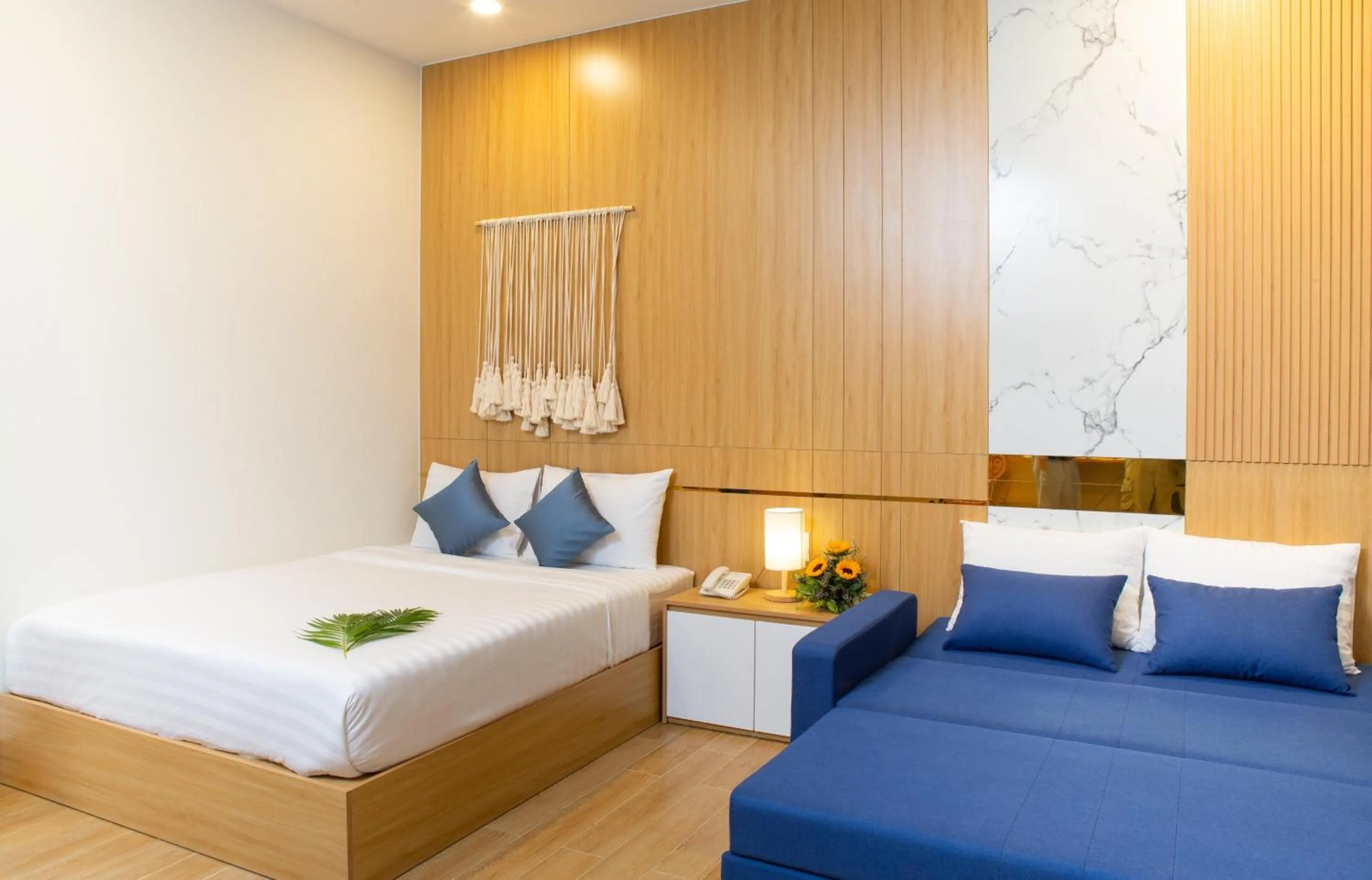 Bed in Vy's House Phanthiet Hotel