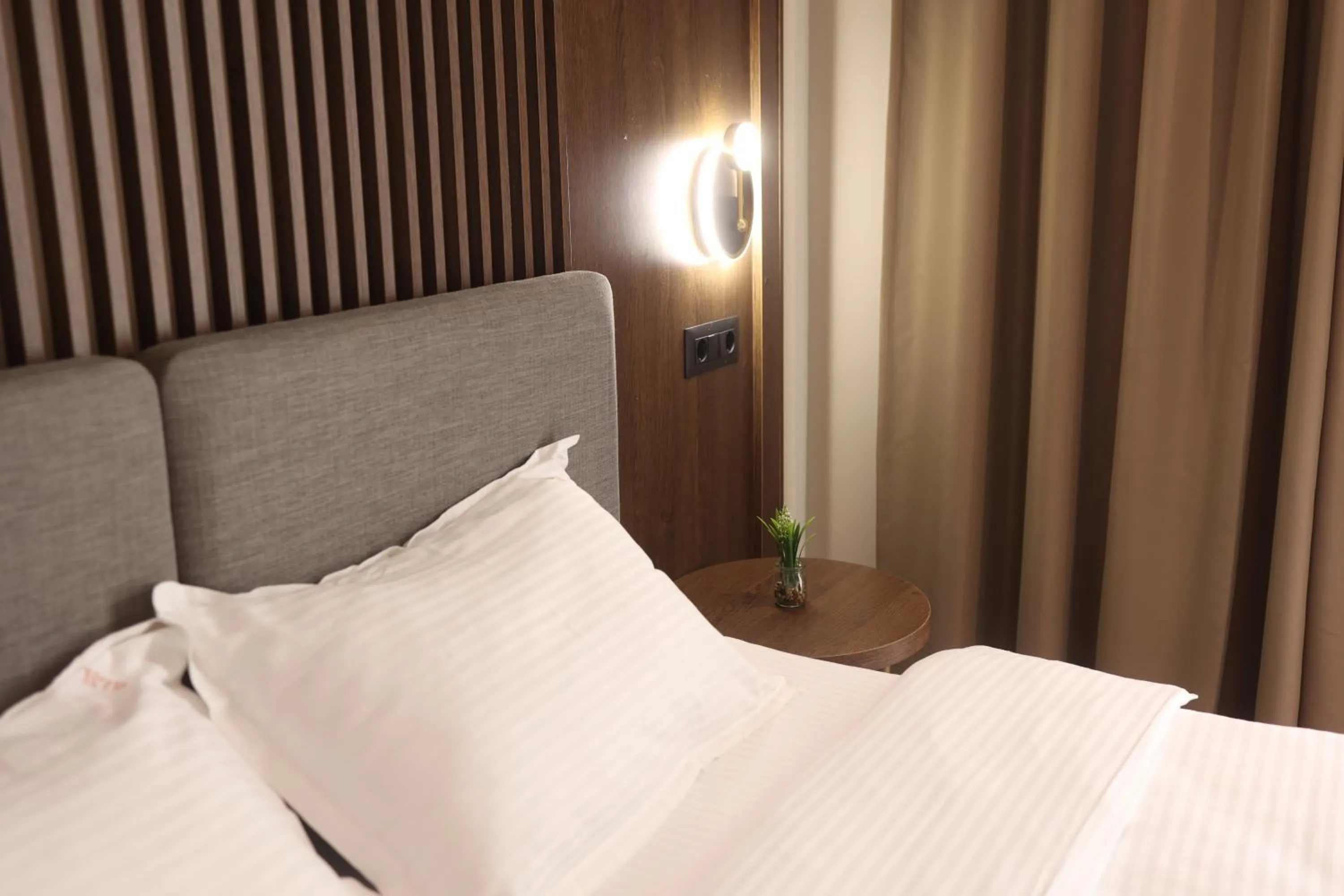 Bed in Sonio Boutique Hotel