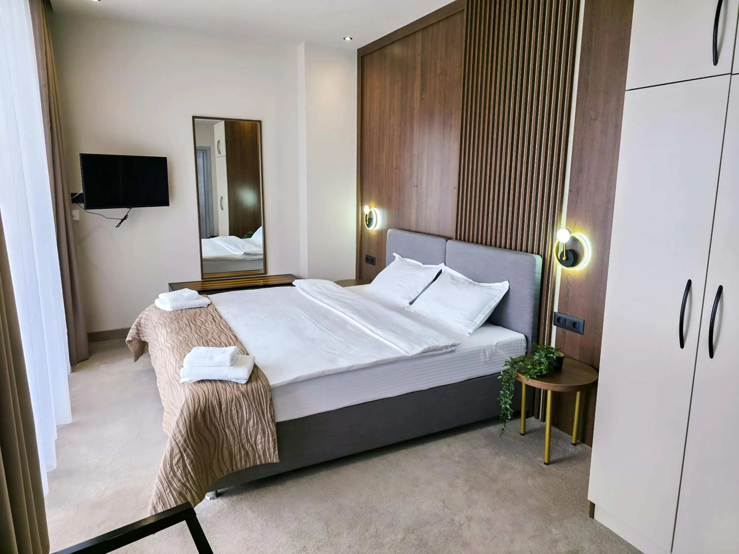 Communal lounge/ TV room, Bed in Sonio Boutique Hotel