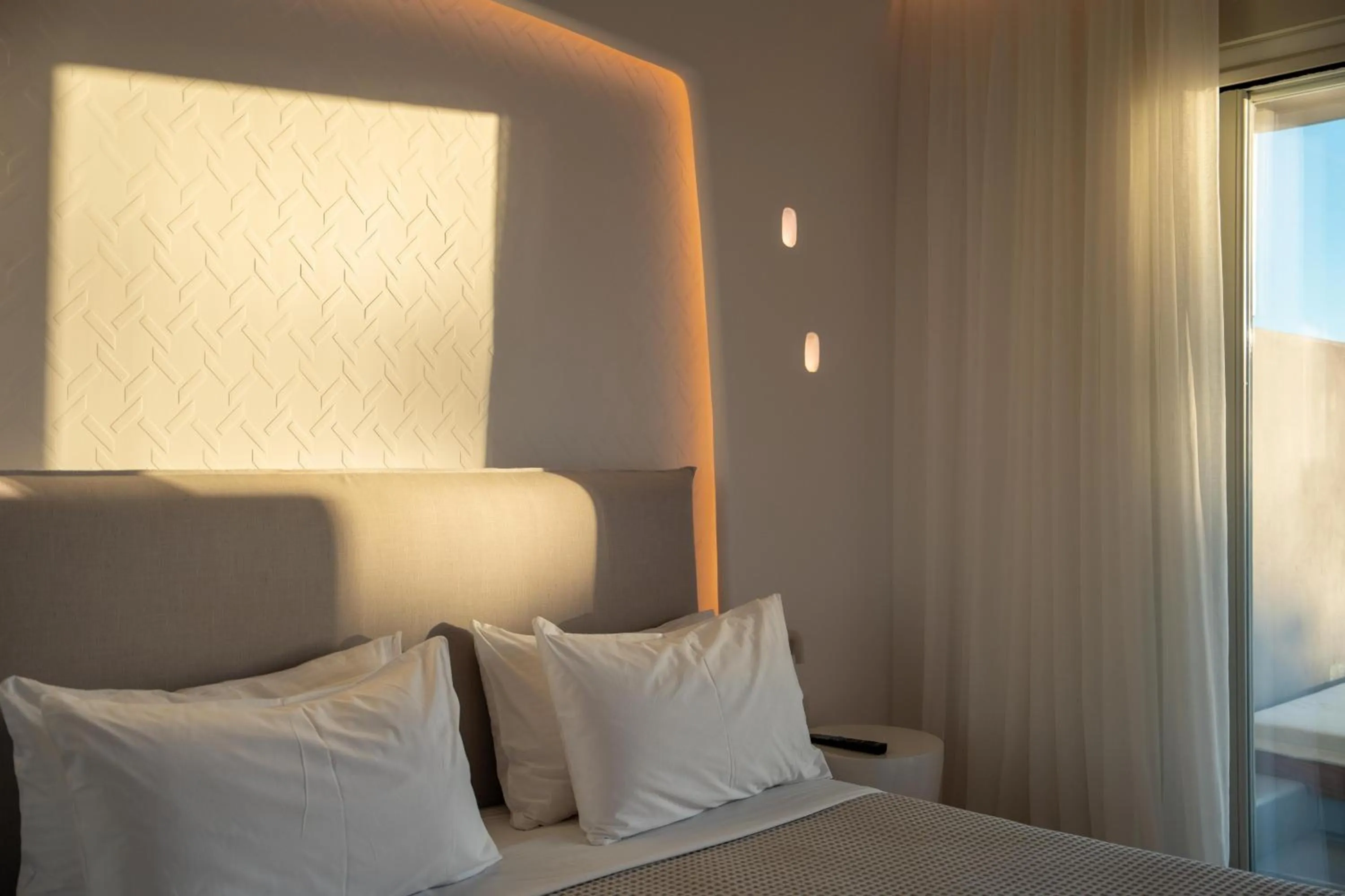 Bed in Nomia Sunset Suites Mykonos