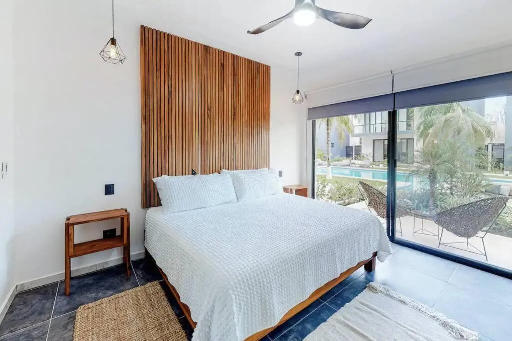 Bed in Contemporary poolside Condo, Wi-Fi - Paraiso Kaanal 101