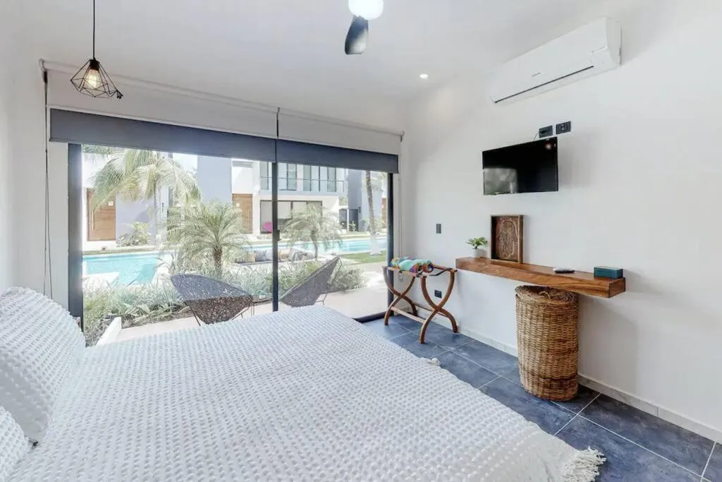 Bed in Contemporary poolside Condo, Wi-Fi - Paraiso Kaanal 101