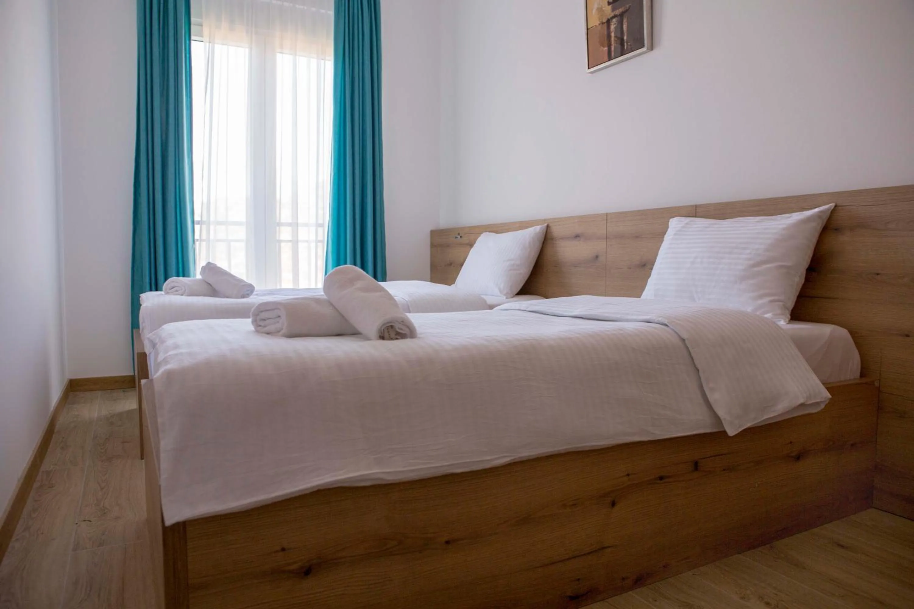 Bed in Pini Apart-hotel