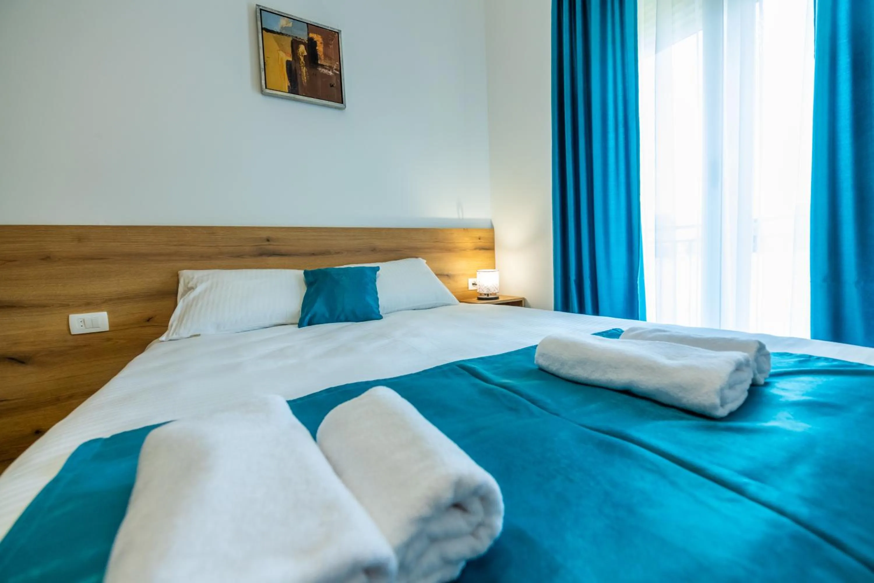 towels, Bed in Pini Apart-hotel