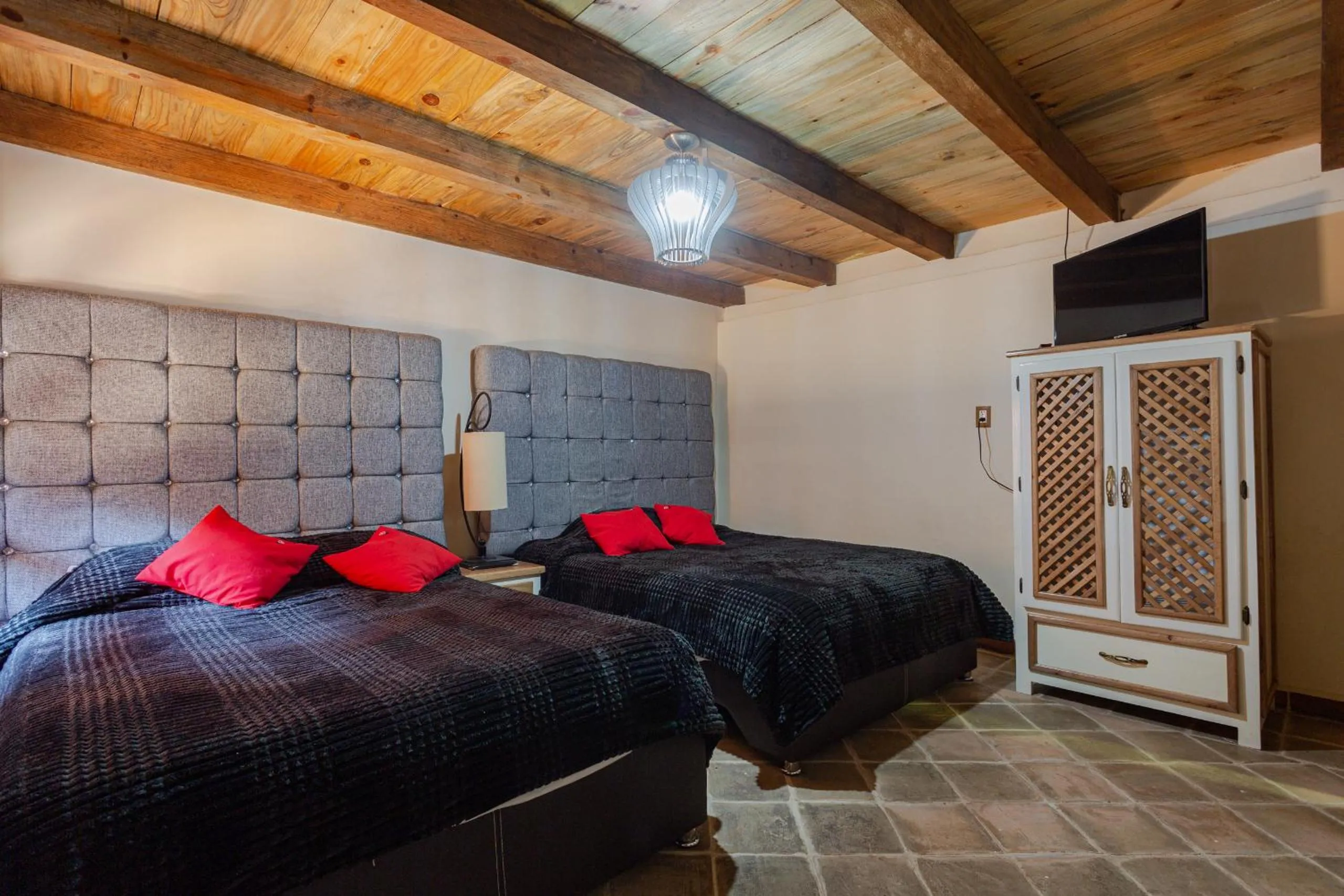 Communal lounge/ TV room, Bed in Hotel Boutique El Rincón